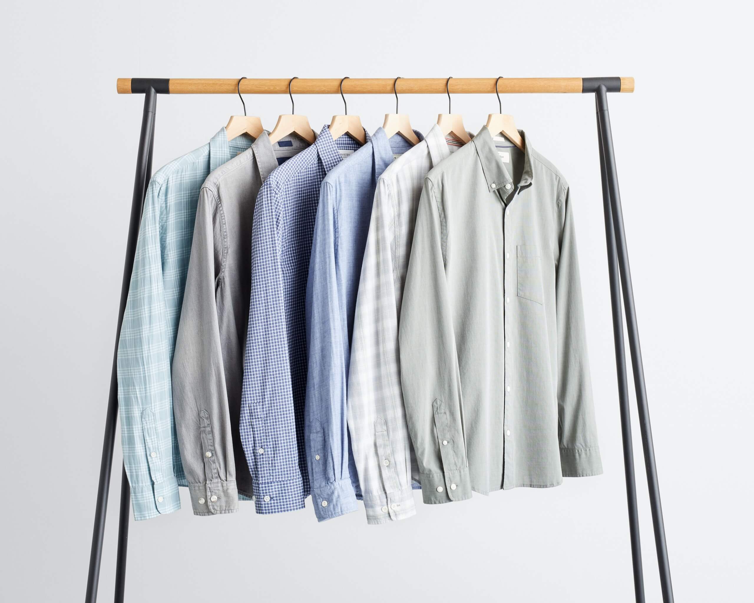 Stitch Fix Men’s rack image with long sleeve button-down shirts in various shades of blue and grey.