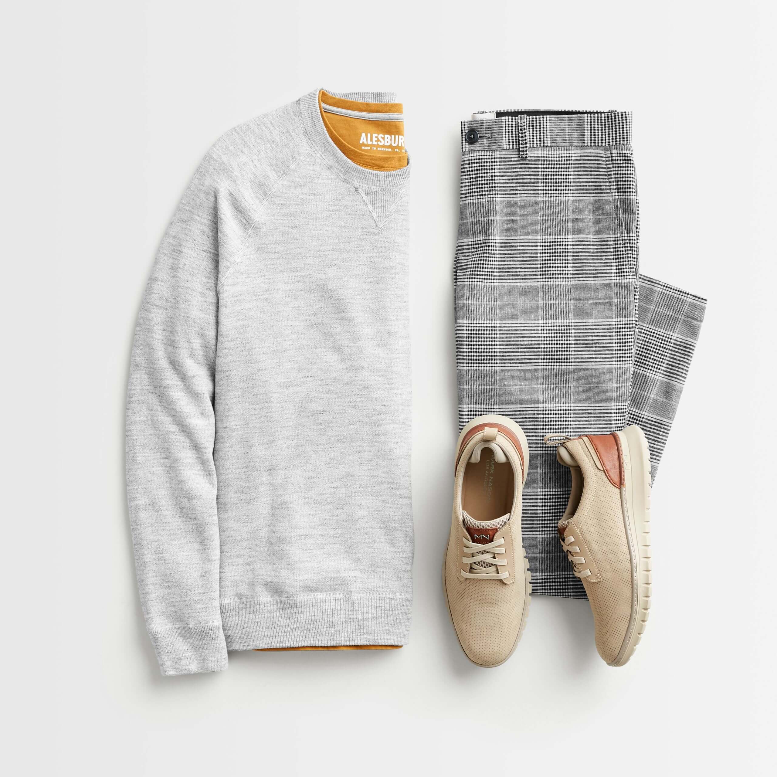 Stitch Fix men's outfit laydown featuring plaid trousers, yellow t-shirt, grey sweater and beige sneakers.