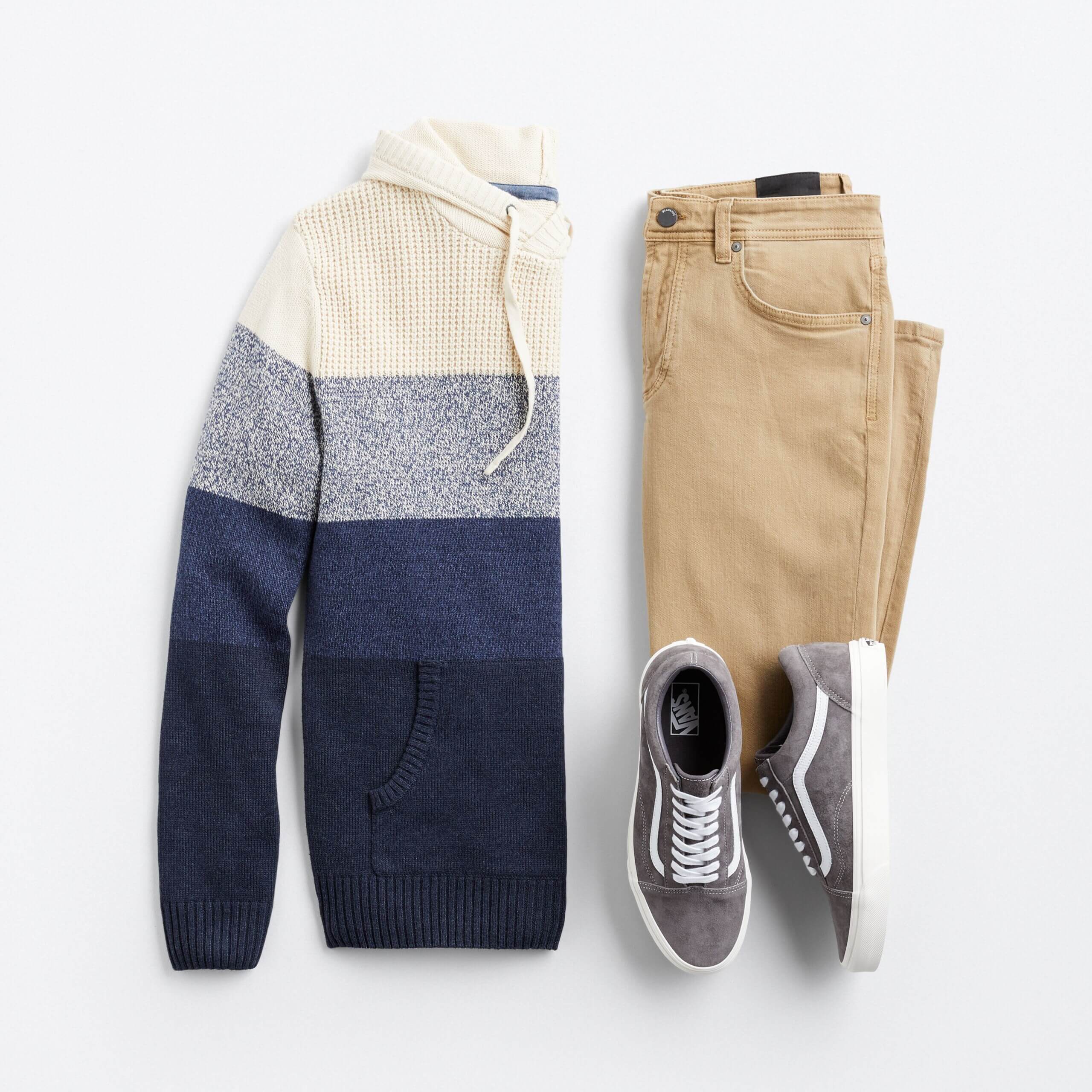Stitch Fix men's outfit laydown featuring khaki jeans, grey sneakers and cream and navy blue striped hoodie.