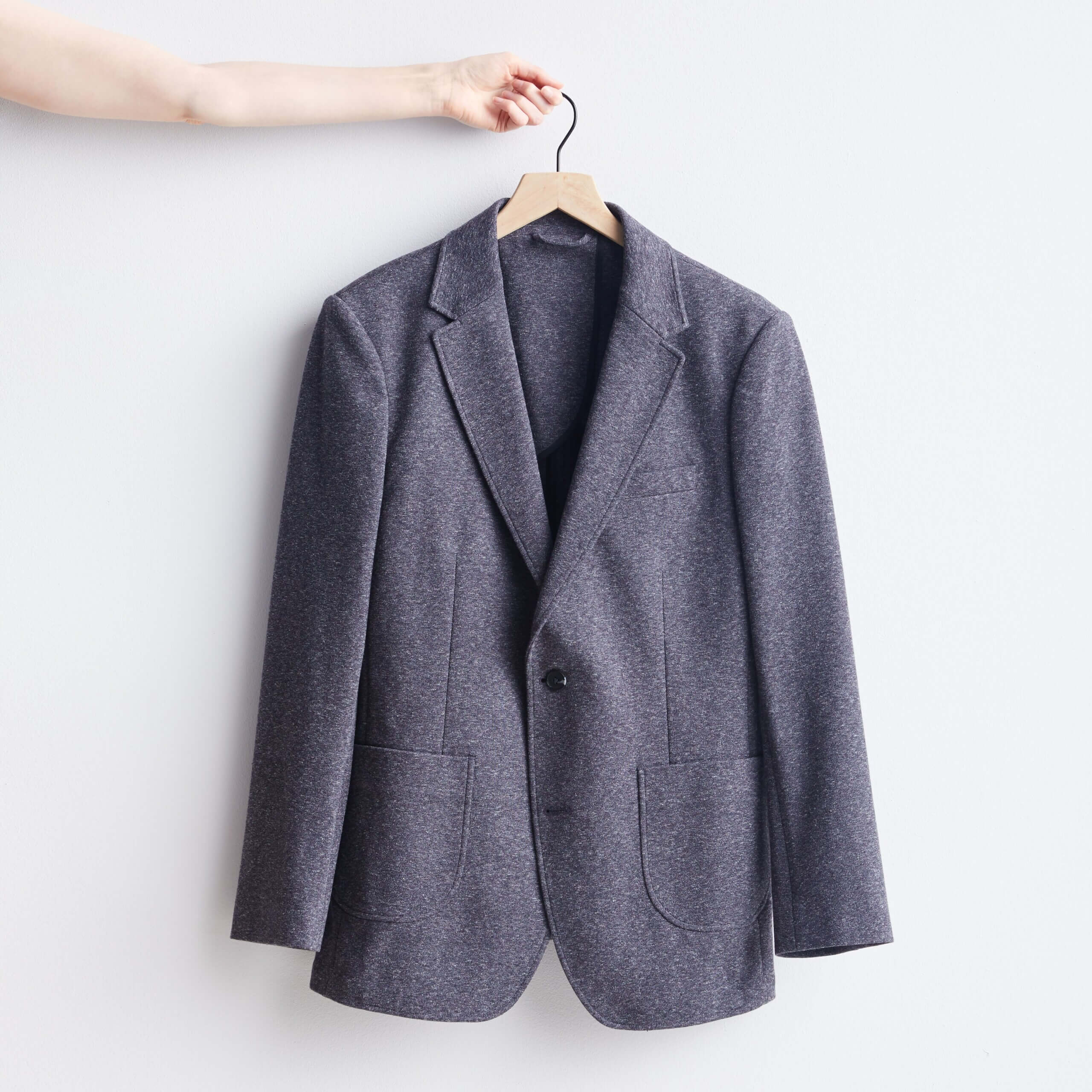 Stitch Fix men's grey blazer on wooden hanger.