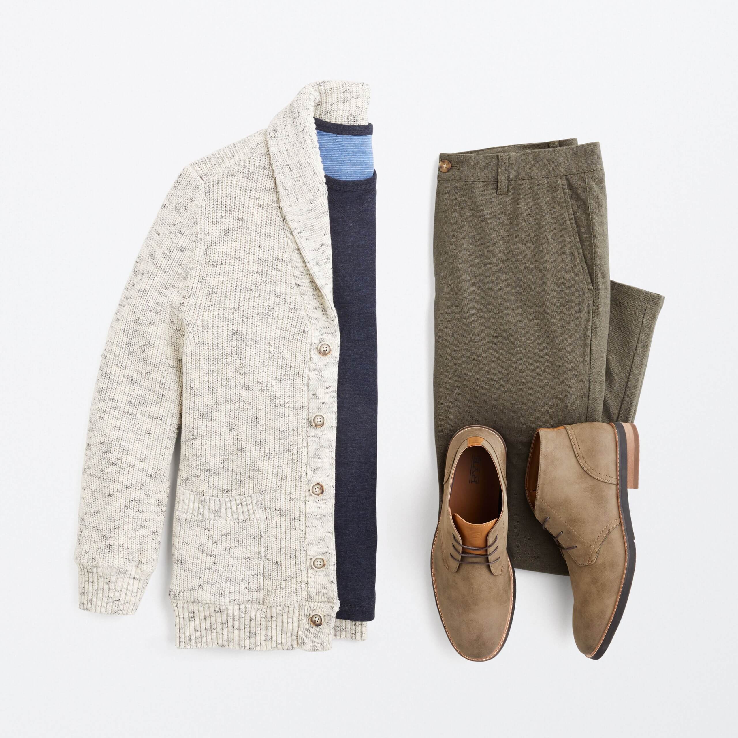 Stitch Fix men's outfit laydown featuring cream cardigan, navy pullover, olive chino pants and chukka boots. 