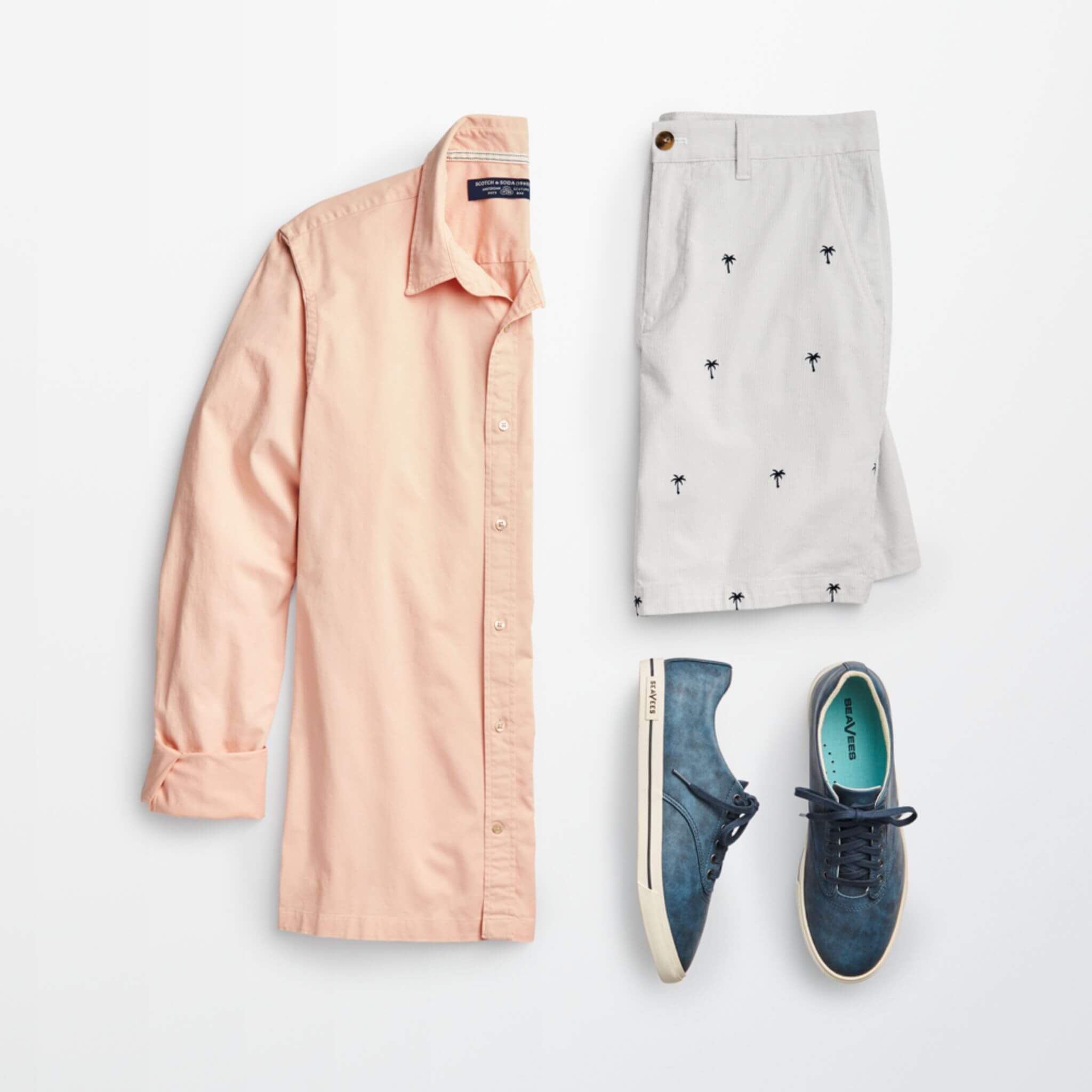 Stitch Fix Men’s outfit laydown featuring peach button-up shirt, patterned shorts with small palm tree print and blue lace-up sneakers. 