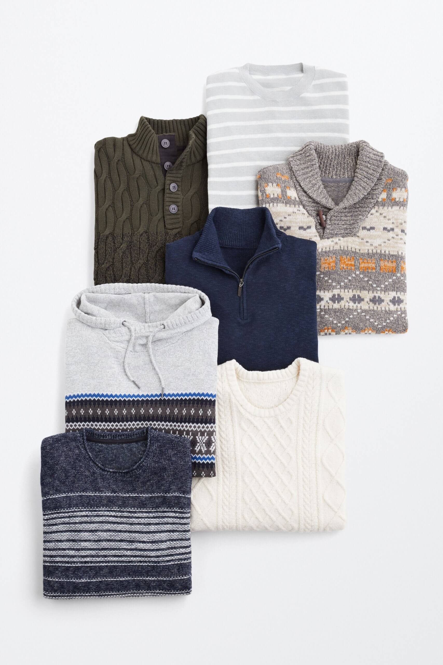 Stitch Fix men's laydown with folded pullover sweaters in grey, navy and cream. 