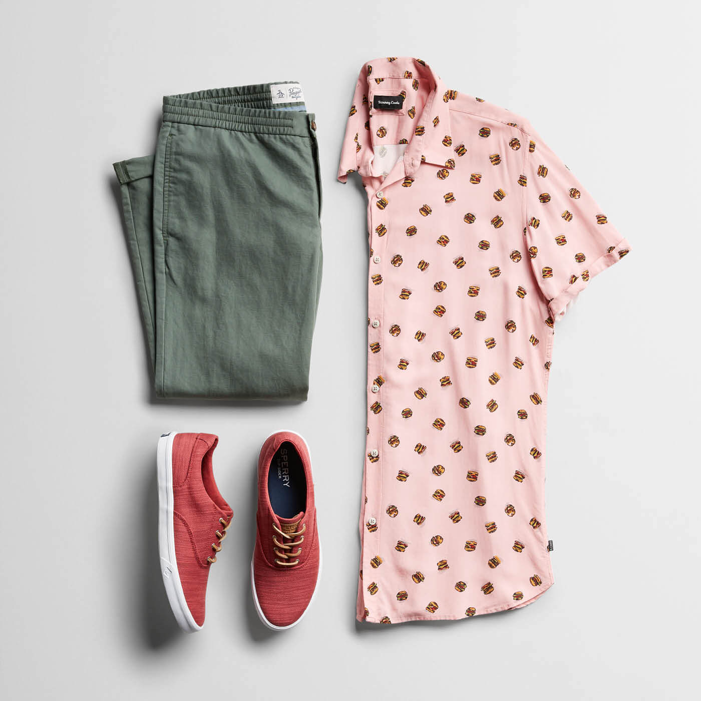 pink printed shirt and green chinos