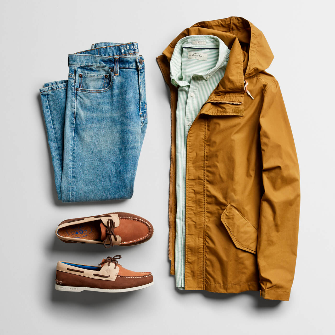 khaki jacket, green button down, light wash jeans and boat shoes