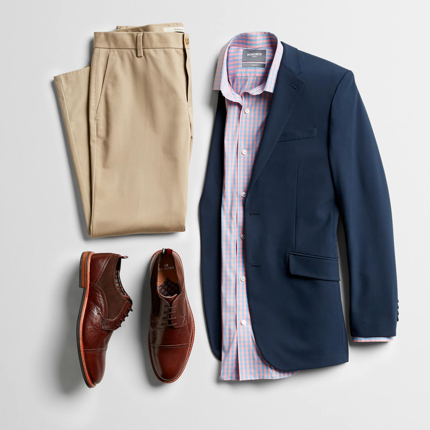 navy blazer, tan dress pants, brown loafers and pink dress shirt