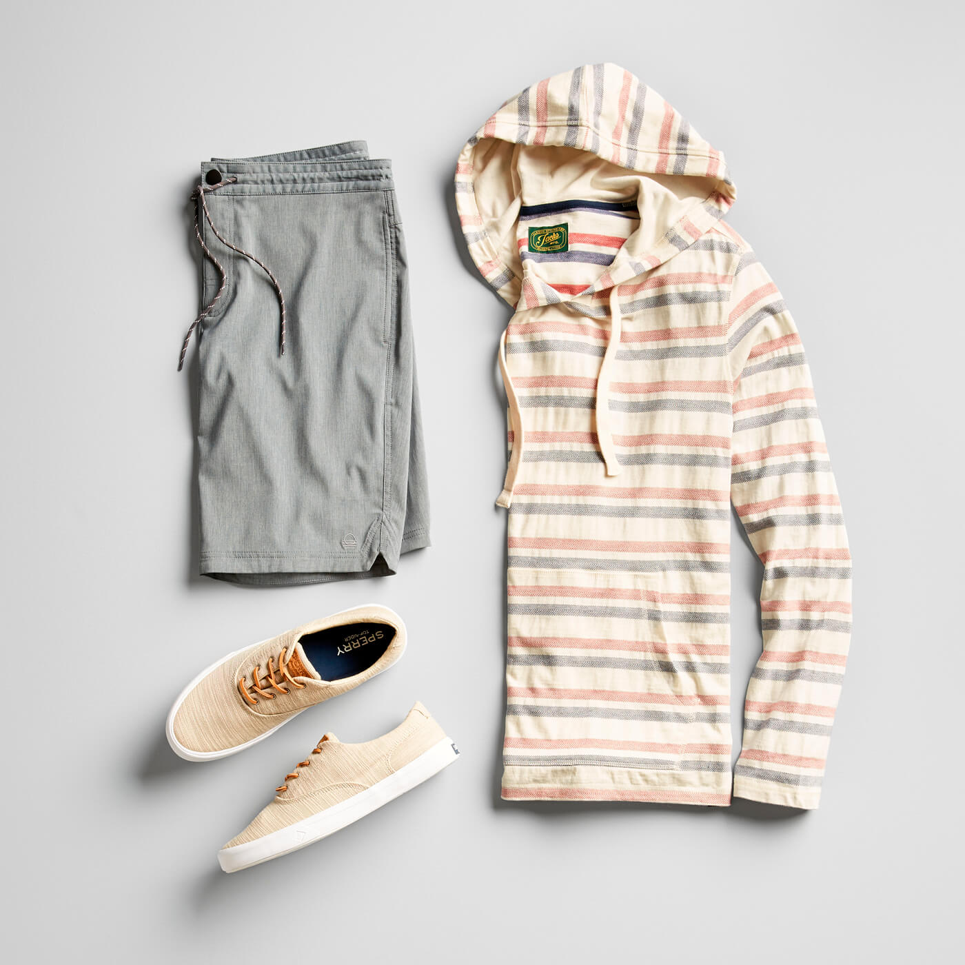 grey hybrid shorts and striped pullover hoodie