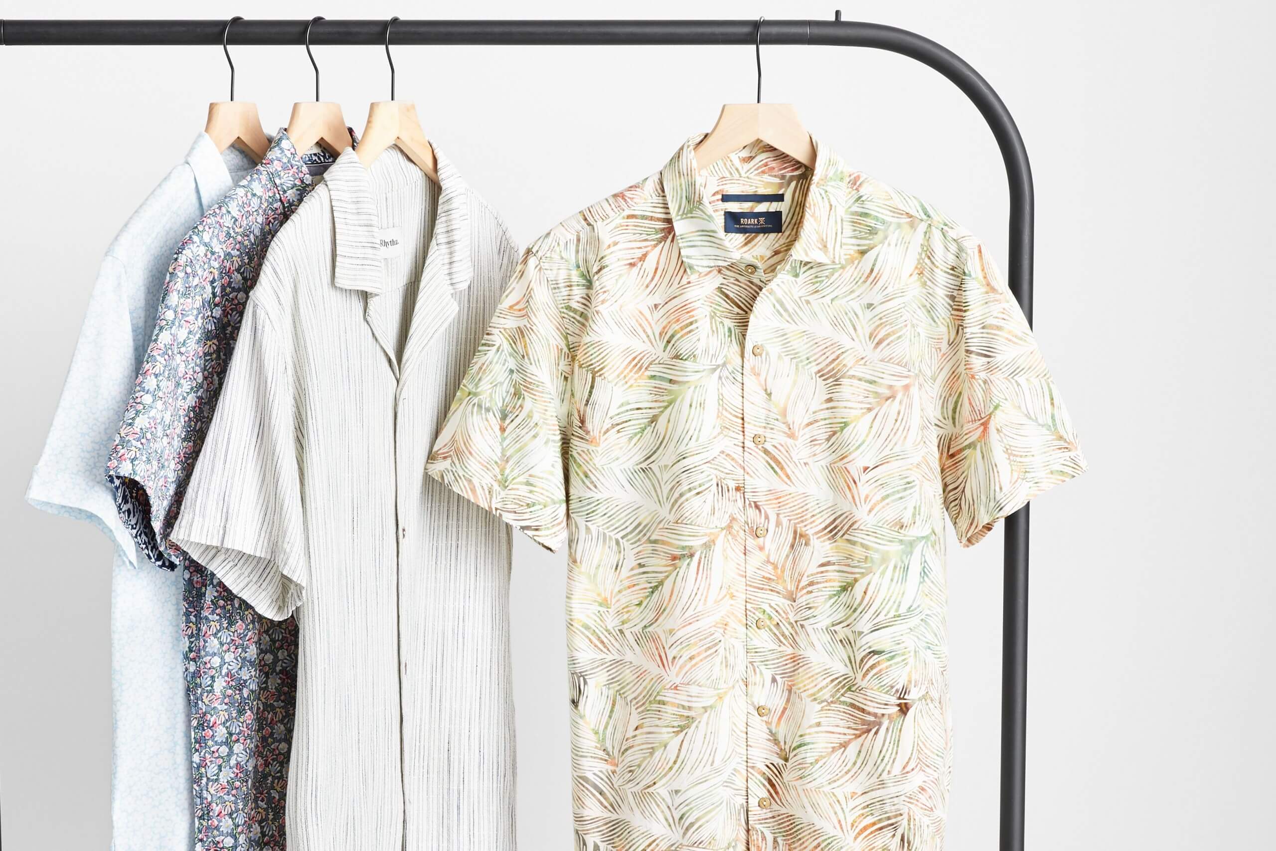 Stitch Fix Men’s four patterned short-sleeved button-downs hanging on a black rack.