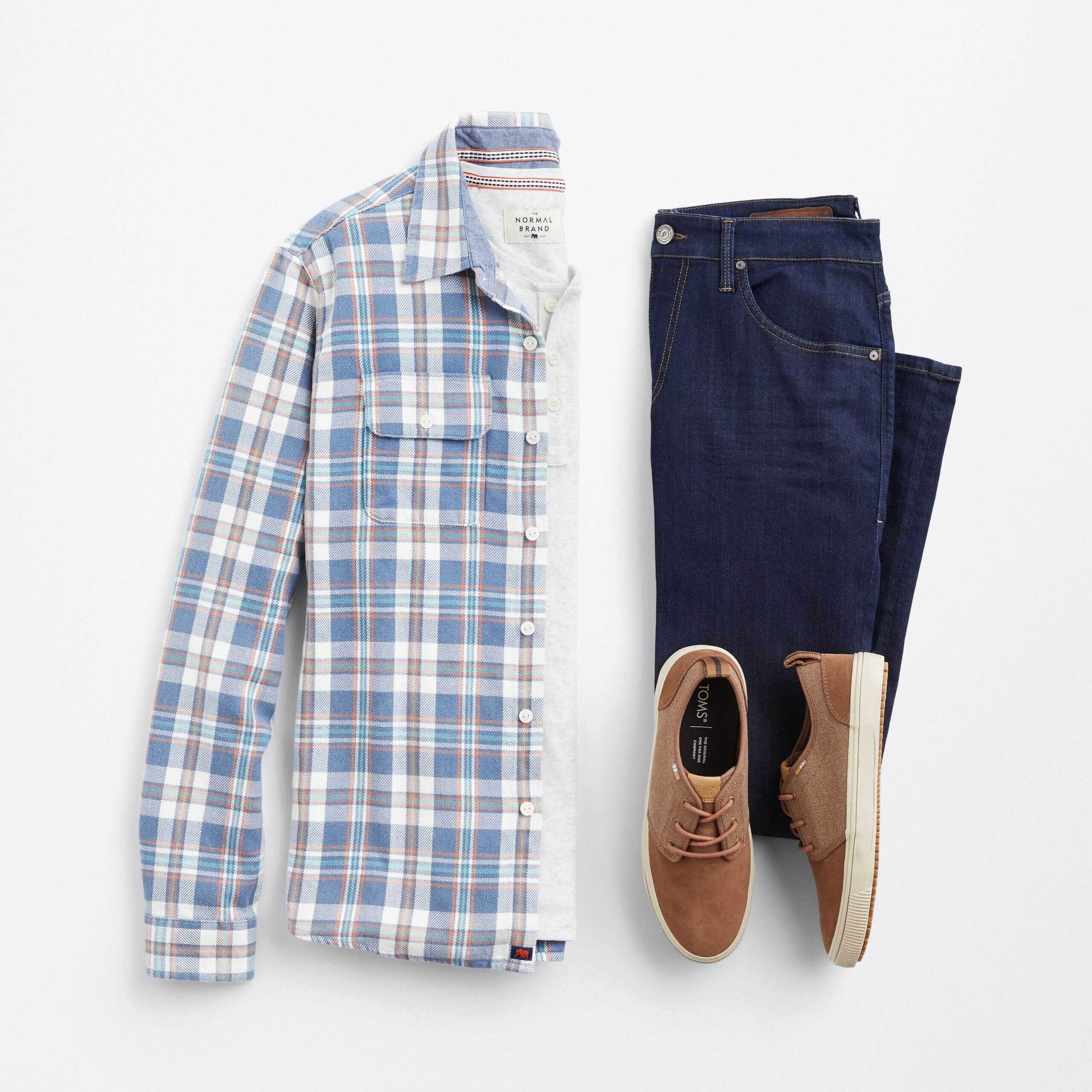 Stitch Fix men's outfit laydown featuring blue button-down over grey henley, blue jeans and brown sneakers. 