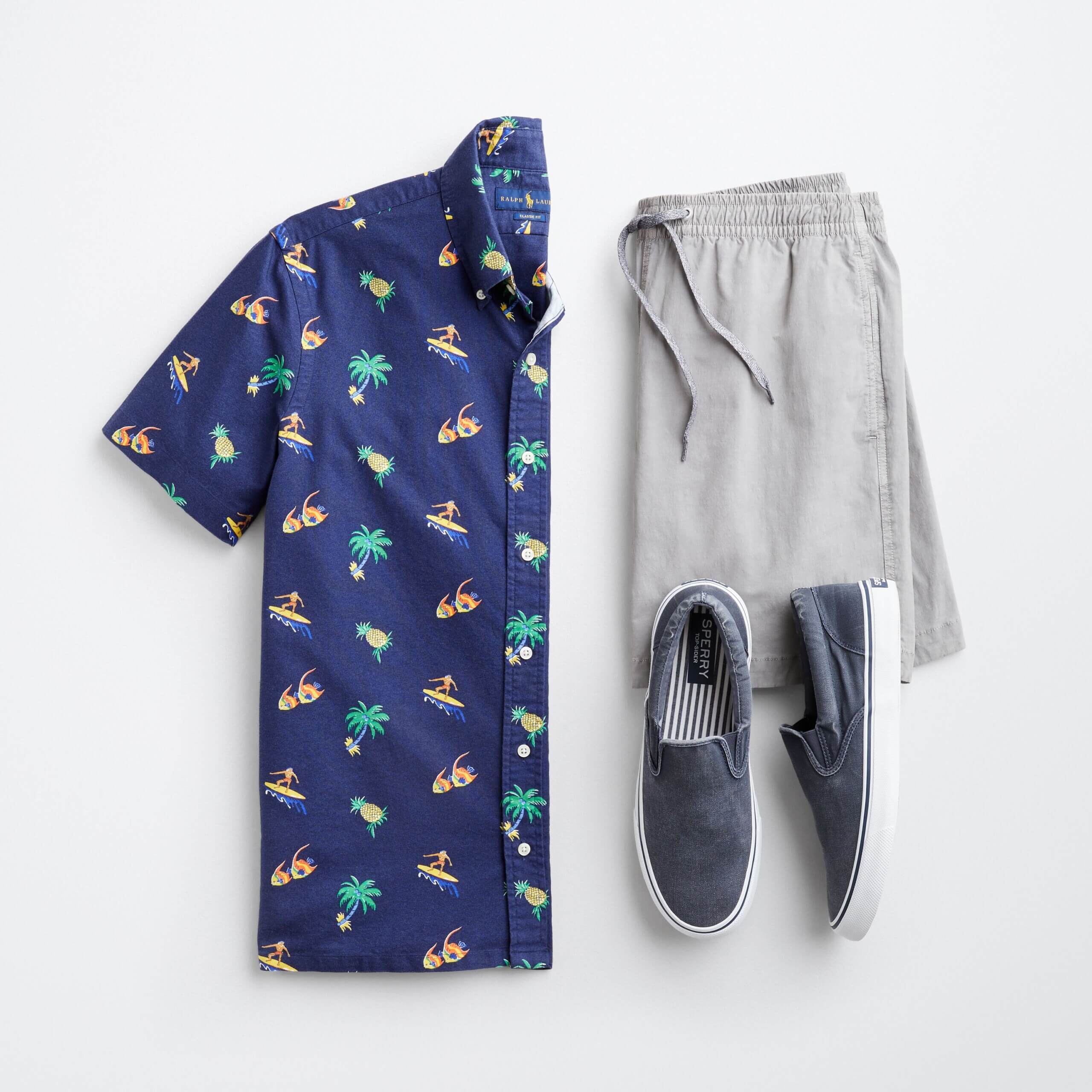 Stitch Fix men's outfit laydown featuring navy blue palm tree print button-down short sleeve shirt, grey shorts and blue canvas sneakers.