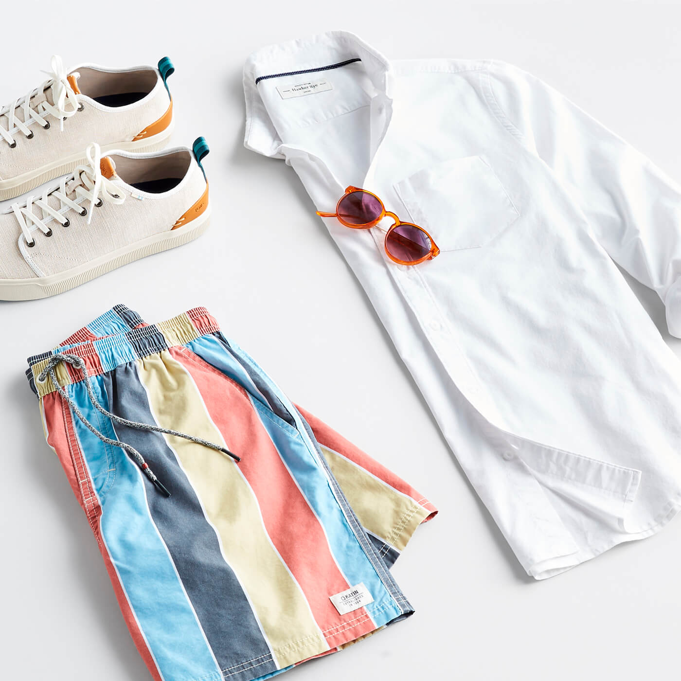 white oxford shirt with swim trunks