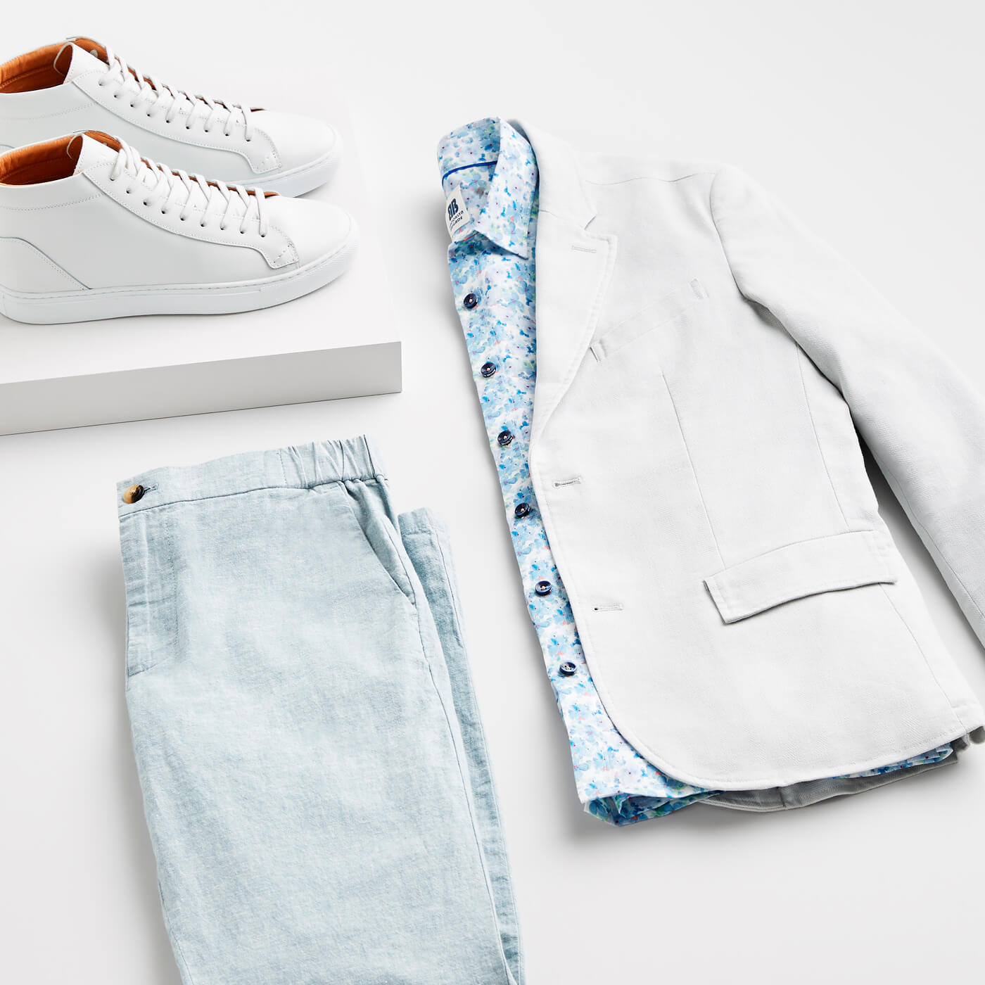 grey blazer and blue pants