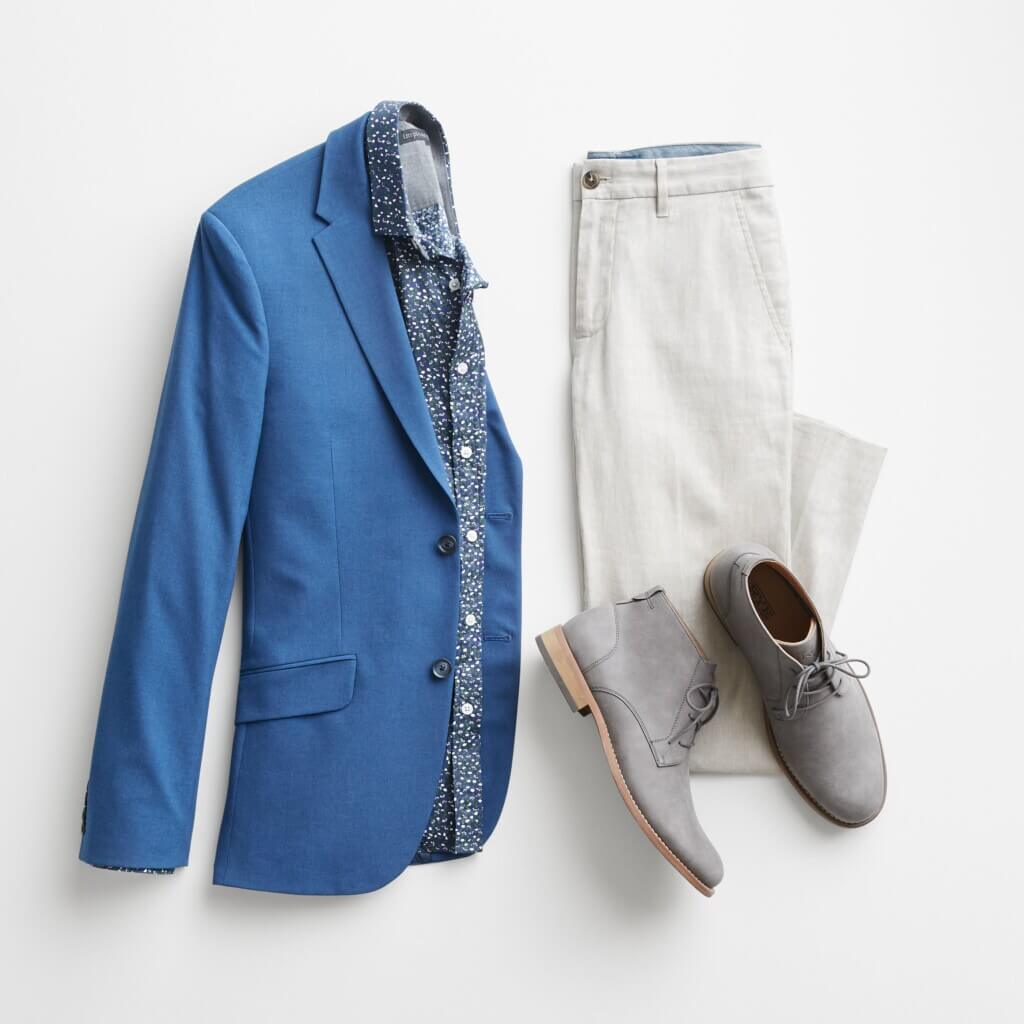 Stitch Fix Men’s Wedding outfit featuring tan chinos, micro-floral button-down shirts, blue blazer and grey chukka boots.