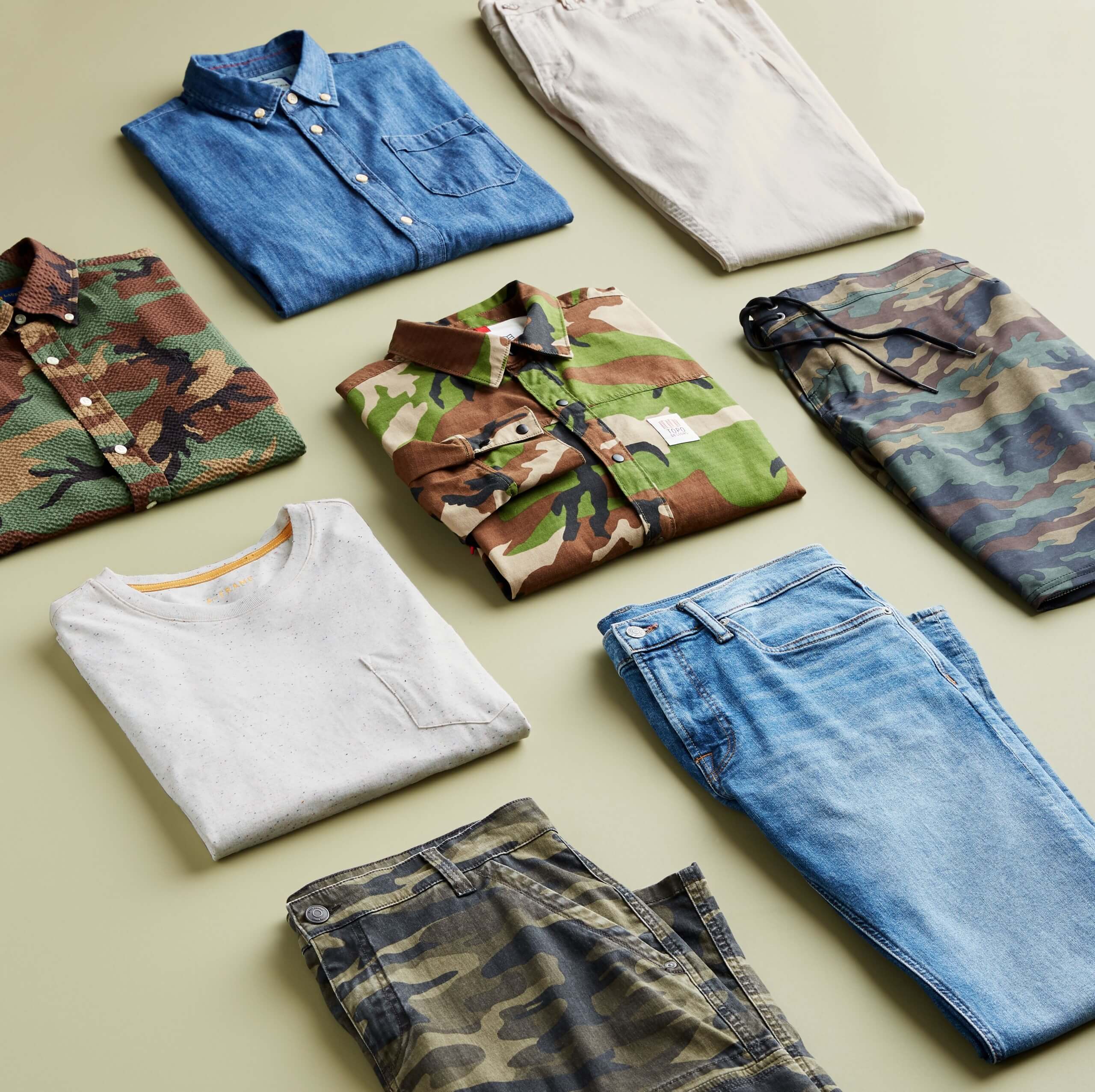 Stitch Fix men’s outfit laydown featuring camouflage items, chambray button-down shirt, white T-shirt and blue jeans.