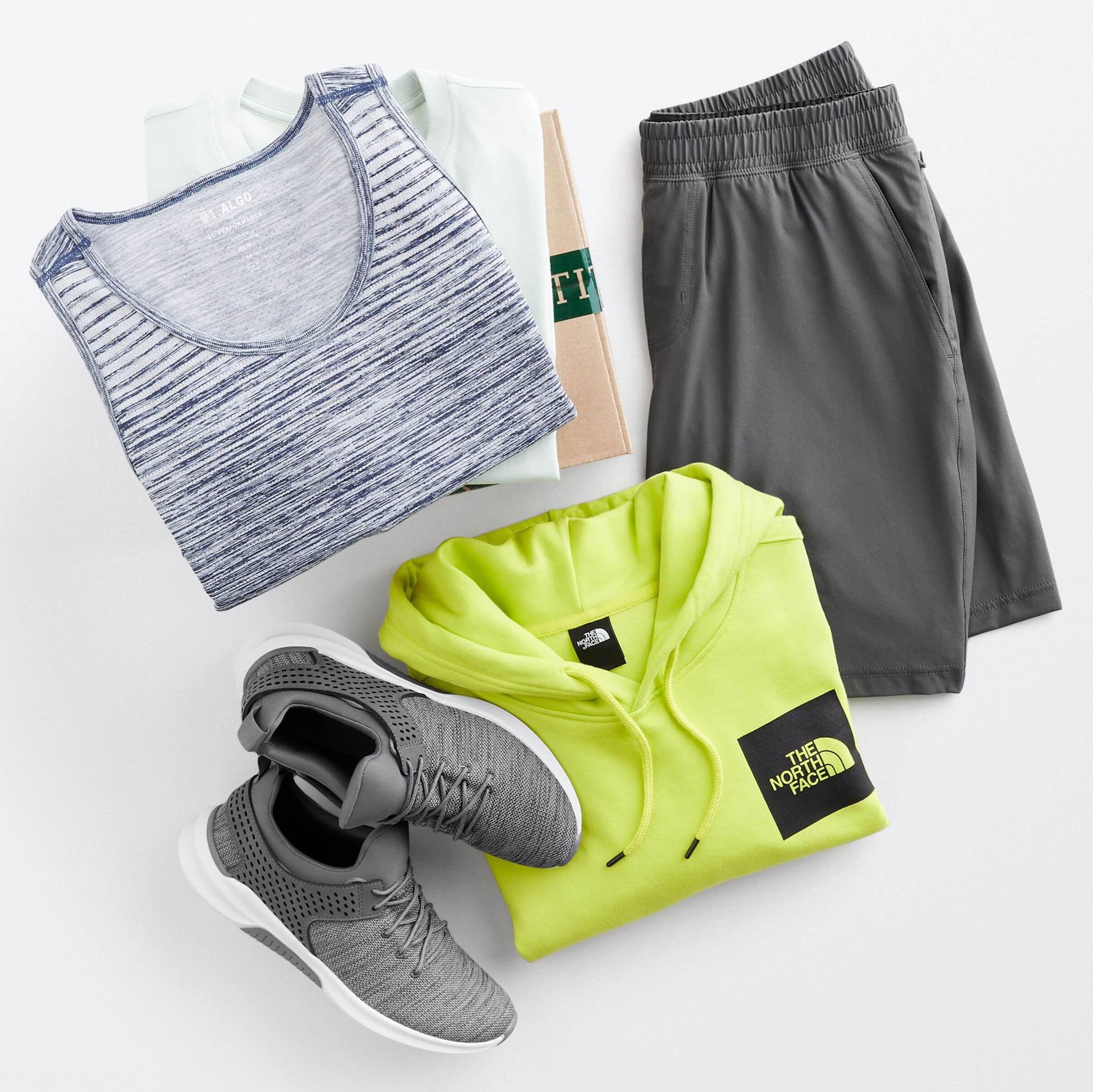 Stitch Fix men’s outfit laydown featuring a blue stripe tank, grey performance shorts, neon green hoodie and grey sneakers.