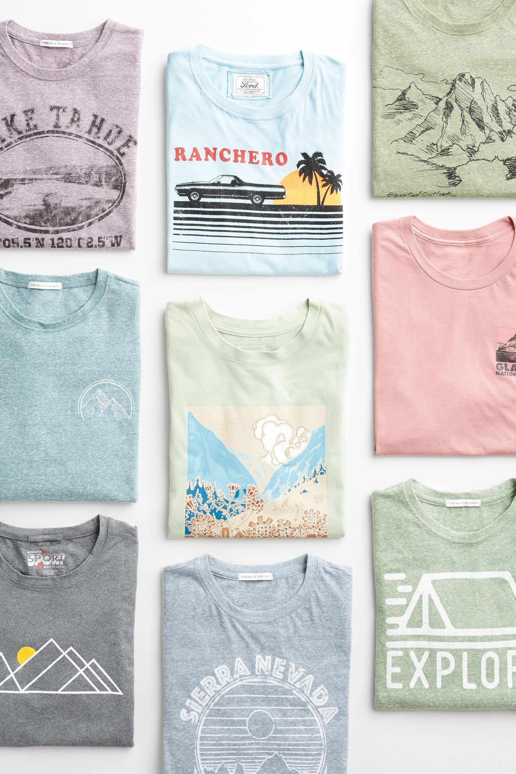 Stitch Fix men’s camping and mountain graphic T-shirts laydown in green, blue, purple, grey and pink.