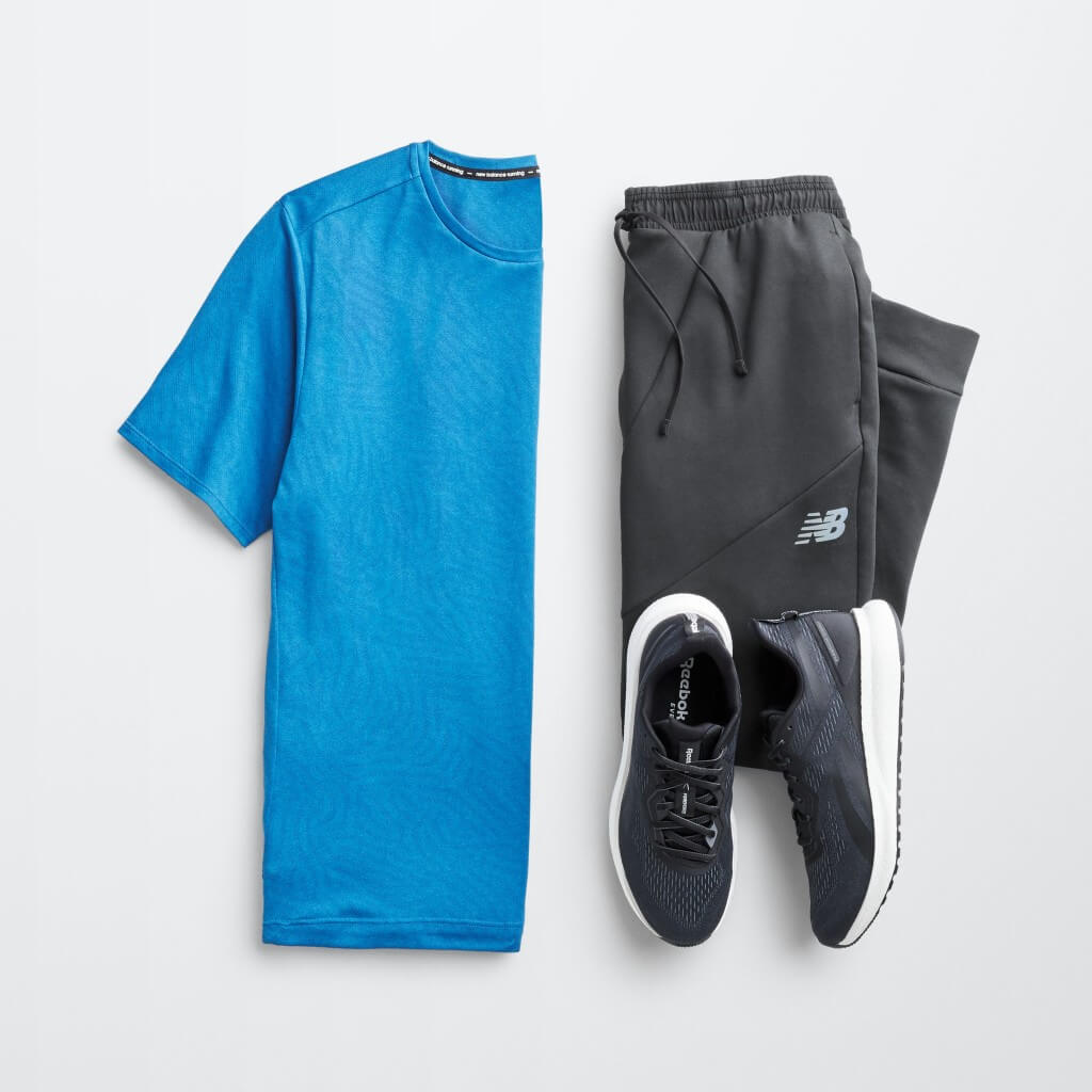 Stitch Fix men’s outfit laydown featuring blue T-shirt, black joggers and black sneakers.