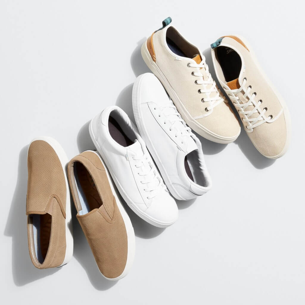 Stitch Fix men’s laydown of tan, white and beige sneakers.