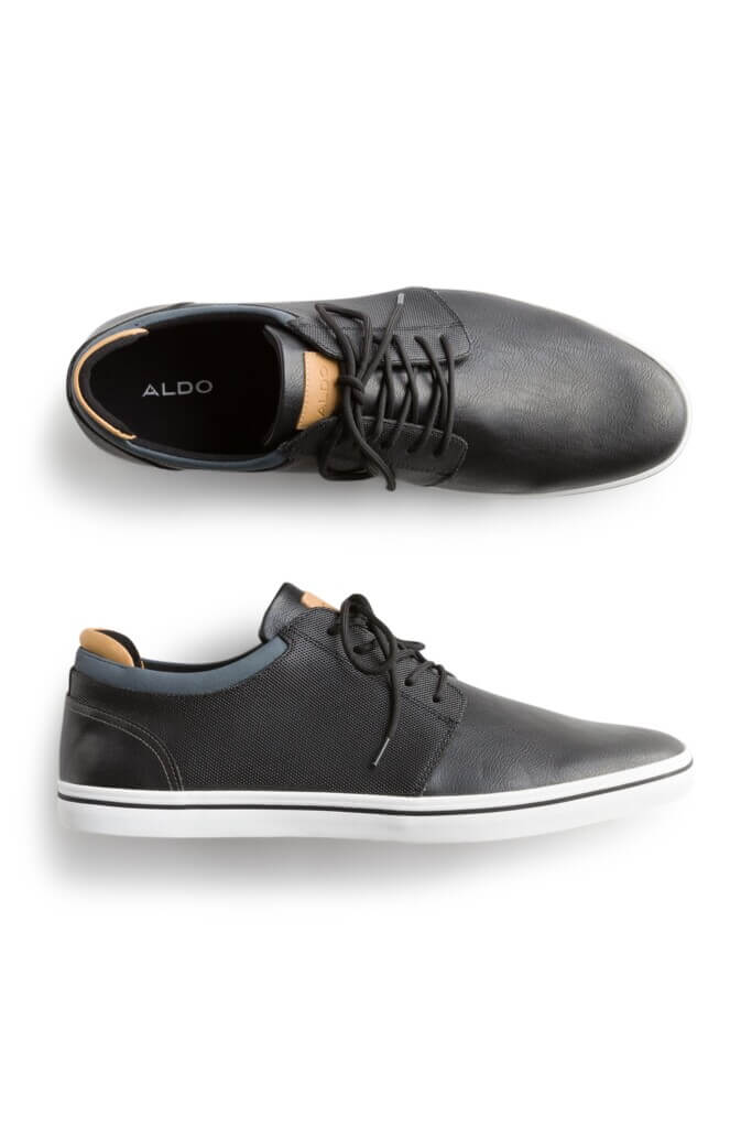 Stitch Fix men’s black sneakers with brown details and white soles.