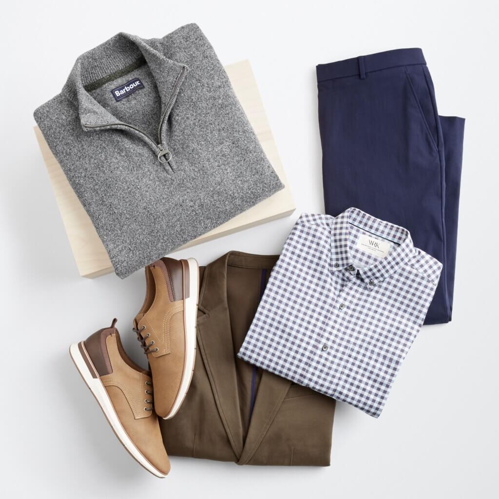 Stitch Fix men’s winter outfit with grey quarter zip, navy trousers, blue and white button-down shirt, brown blazer and light brown shoes.
