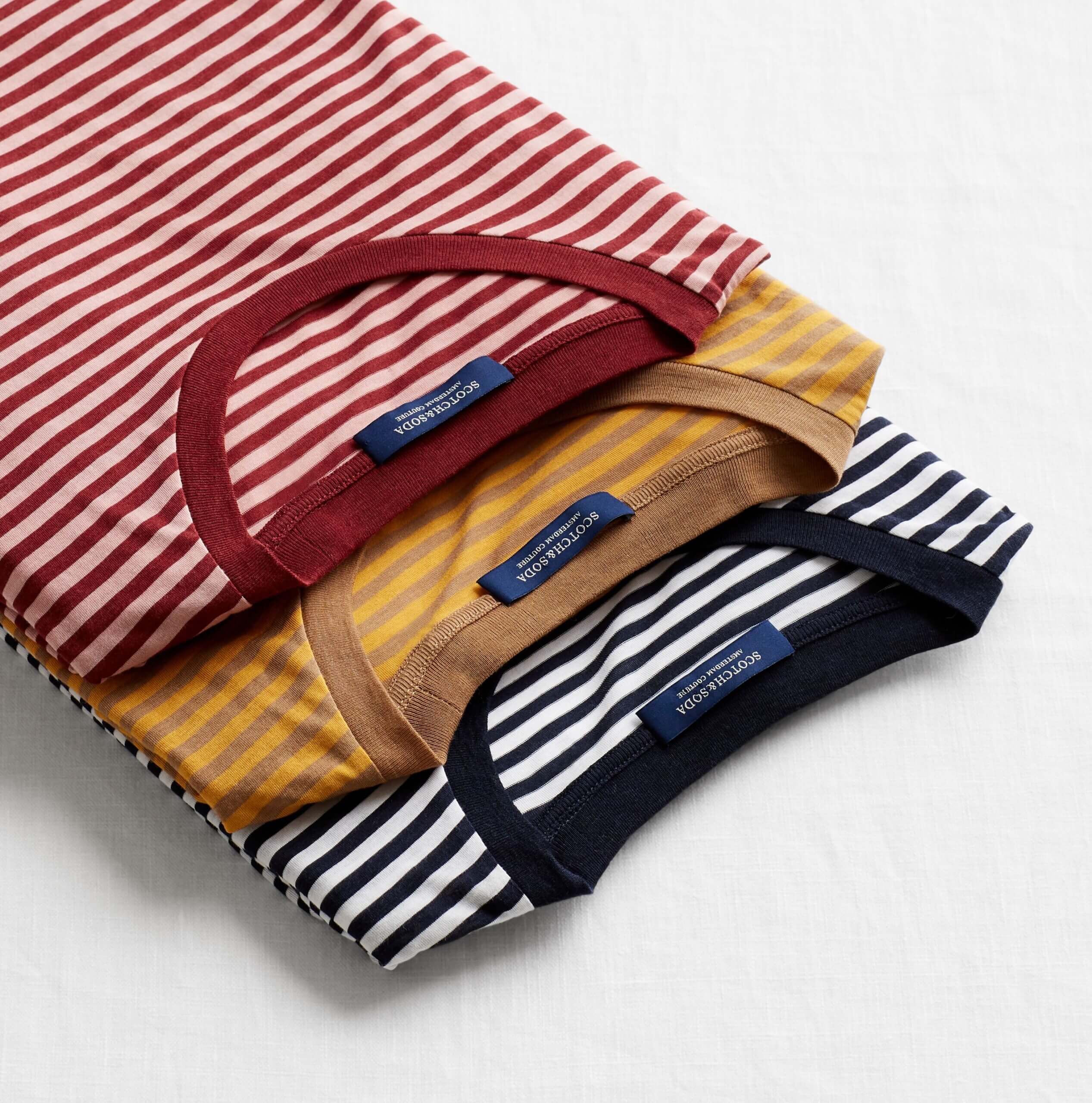 Stitch Fix men’s red and white, mustard and brown and black and white striped T-shirts.