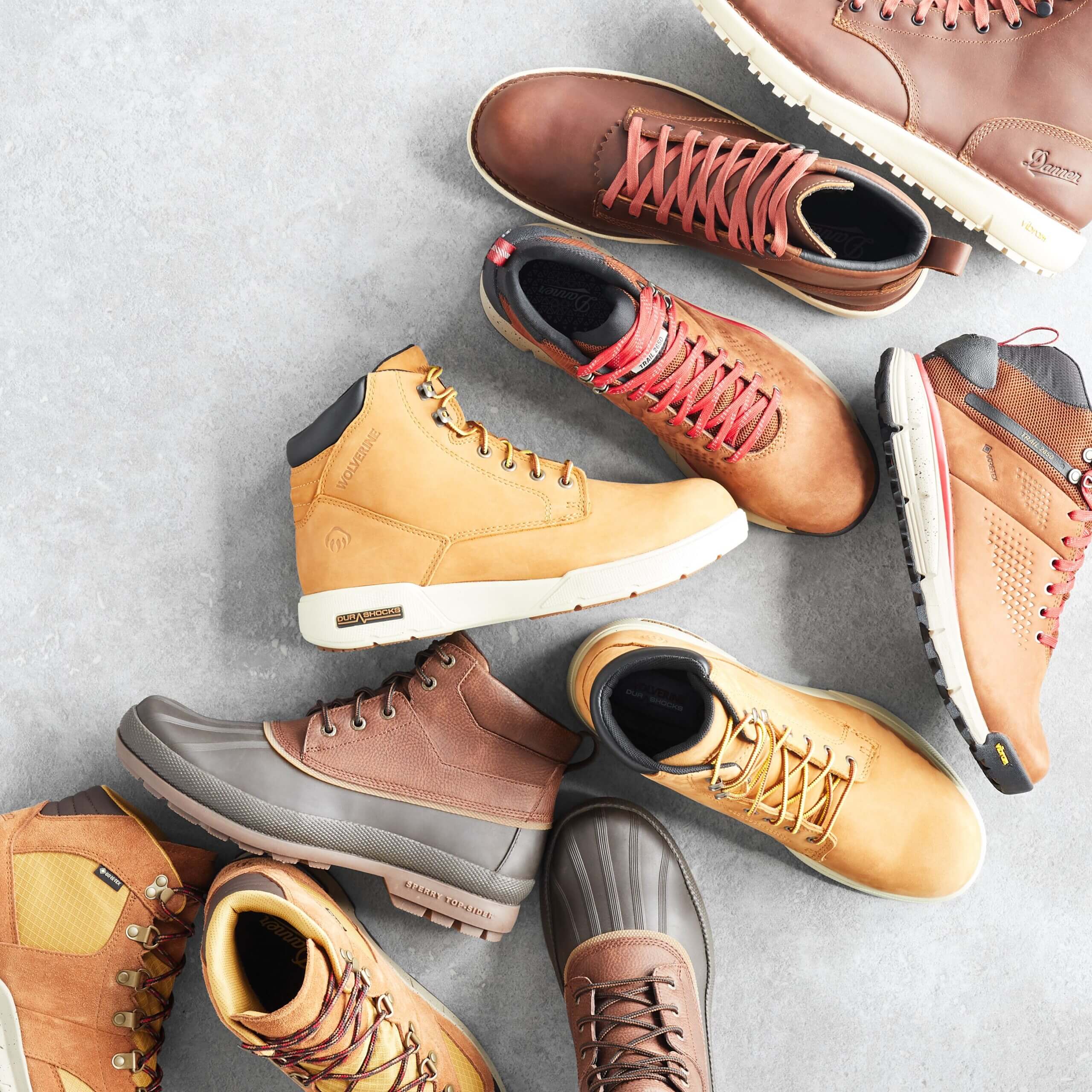 Stitch Fix men’s boot collection featuring duck boots and assorted lace-up brown leather boots with sport bottoms.