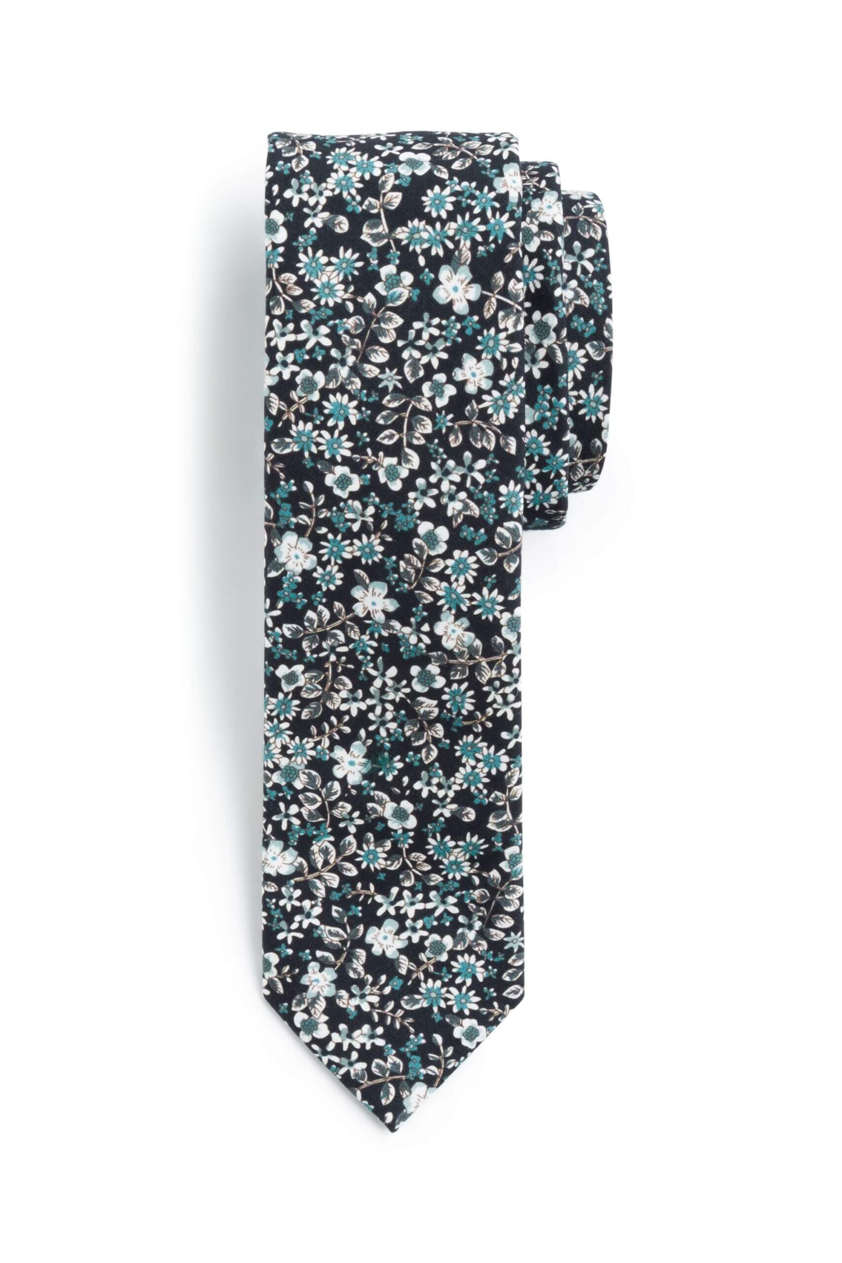 Stitch Fix men’s navy, blue and white floral necktie wound up.