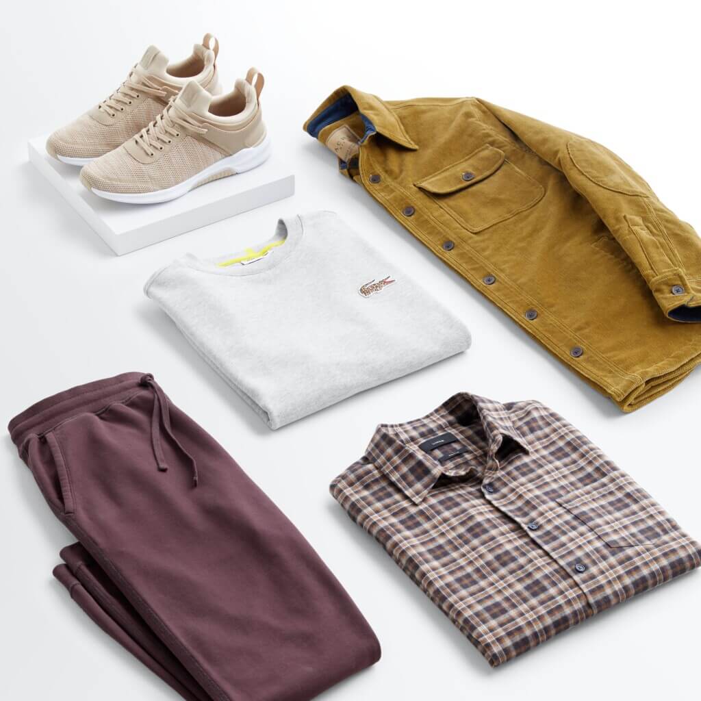 Stitch Fix men’s outfit for shorter men featuring burgundy joggers, grey sweatshirt, brown and tan button-down shirt, yellow corduroy shacket and tan sneakers.