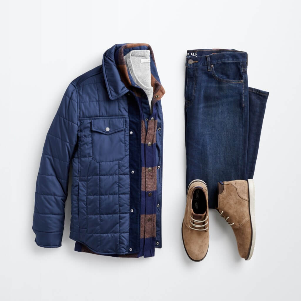 Stitch Fix men’s Christmas outfit featuring red and black plaid shacket over grey sweater next to olive chinos and brown boots.