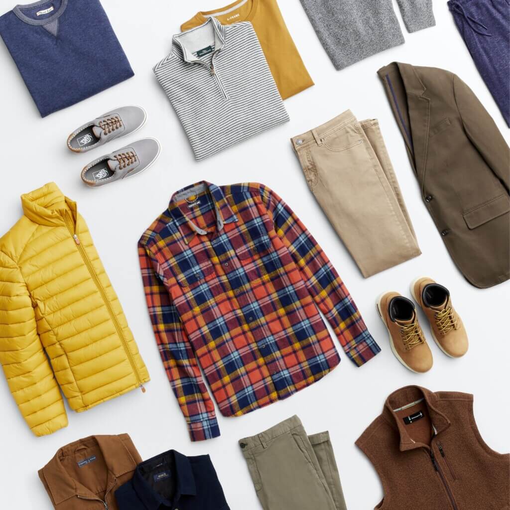 Stitch Fix men’s outfit laydown featuring a variety of shirts, pants, shoes and layers in various colors and prints.