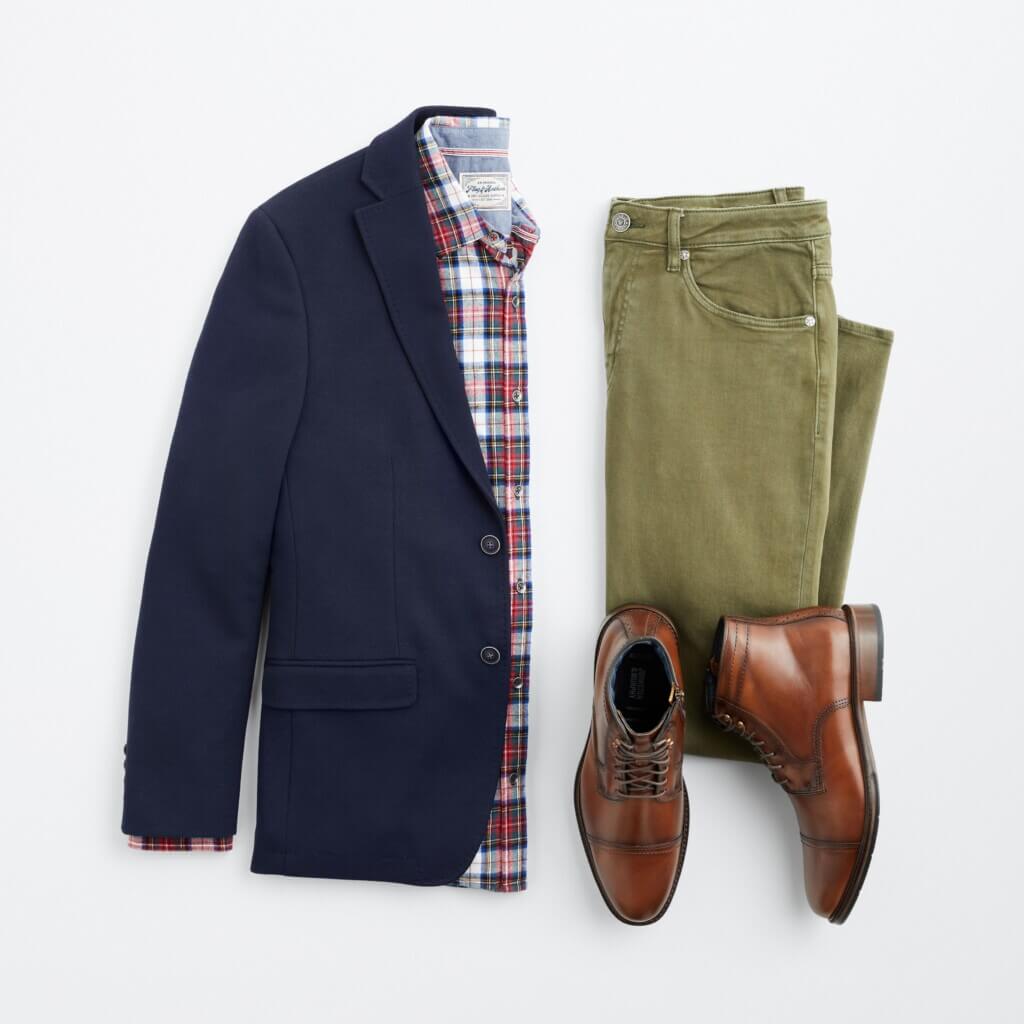 Stitch Fix men’s Christmas outfit featuring grey navy blazer over plaid button-down shirt next to olive jeans and brown boots.