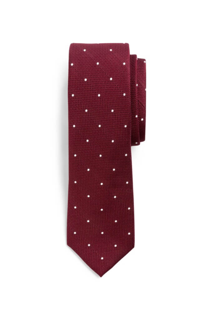 Stitch Fix men’s burgundy tie with white polka dots wound up.