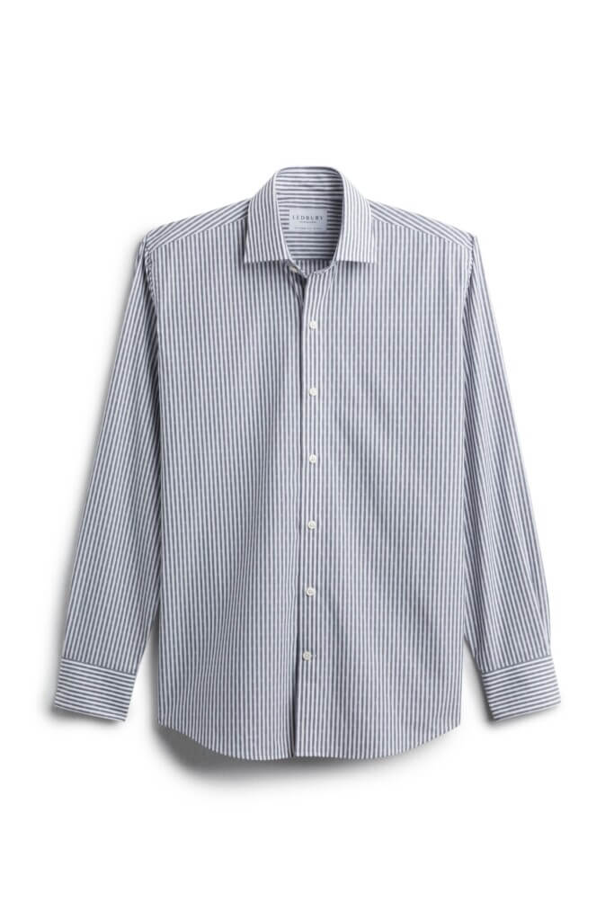 Stitch Fix men’s blue and white vertical striped button-down long-sleeve shirt.