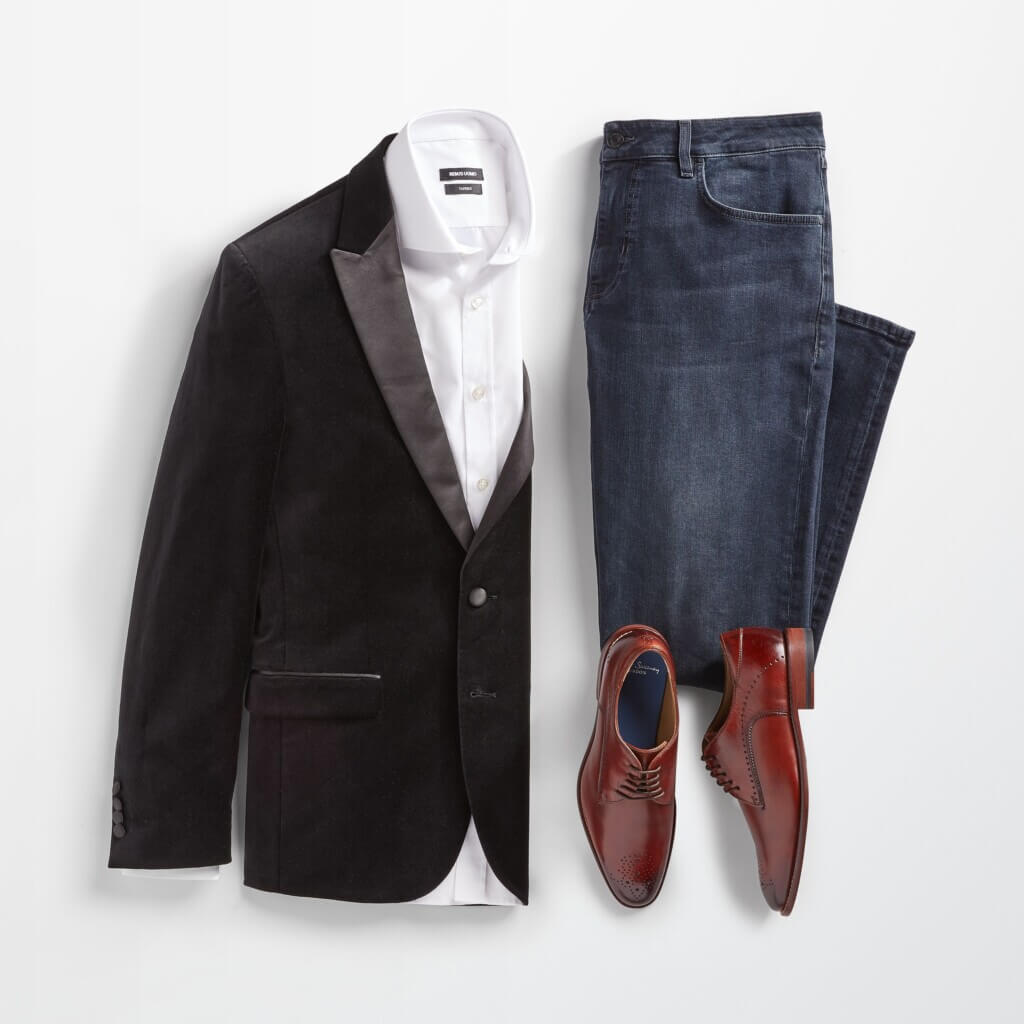 Stitch Fix Valentine's Day outfit for men featuring black velvet blazer over white button-down shirt, next to blue jeans and brown shoes.