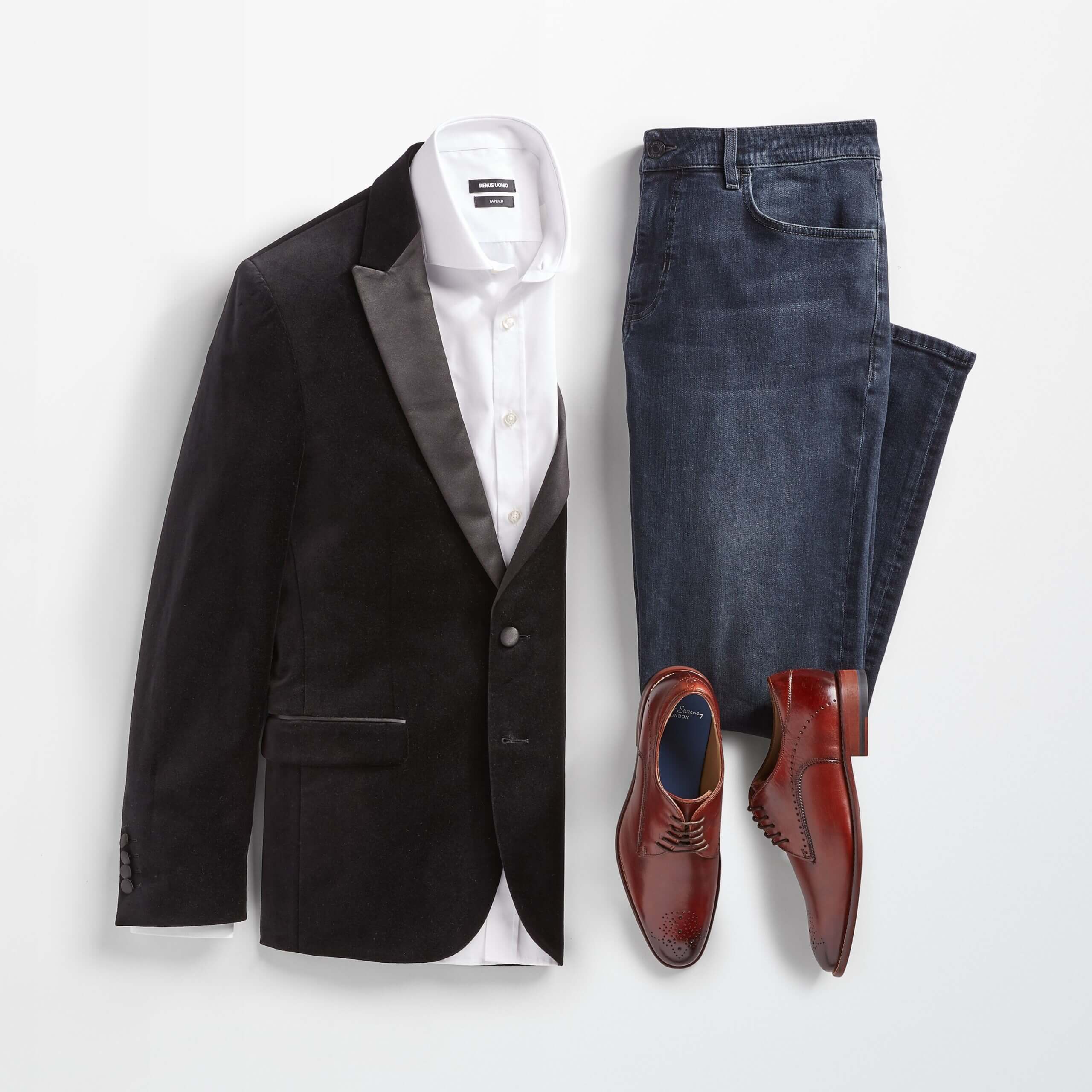 Stitch Fix Valentine's Day outfit for men featuring black velvet blazer over white button-down shirt, next to blue jeans and brown shoes.