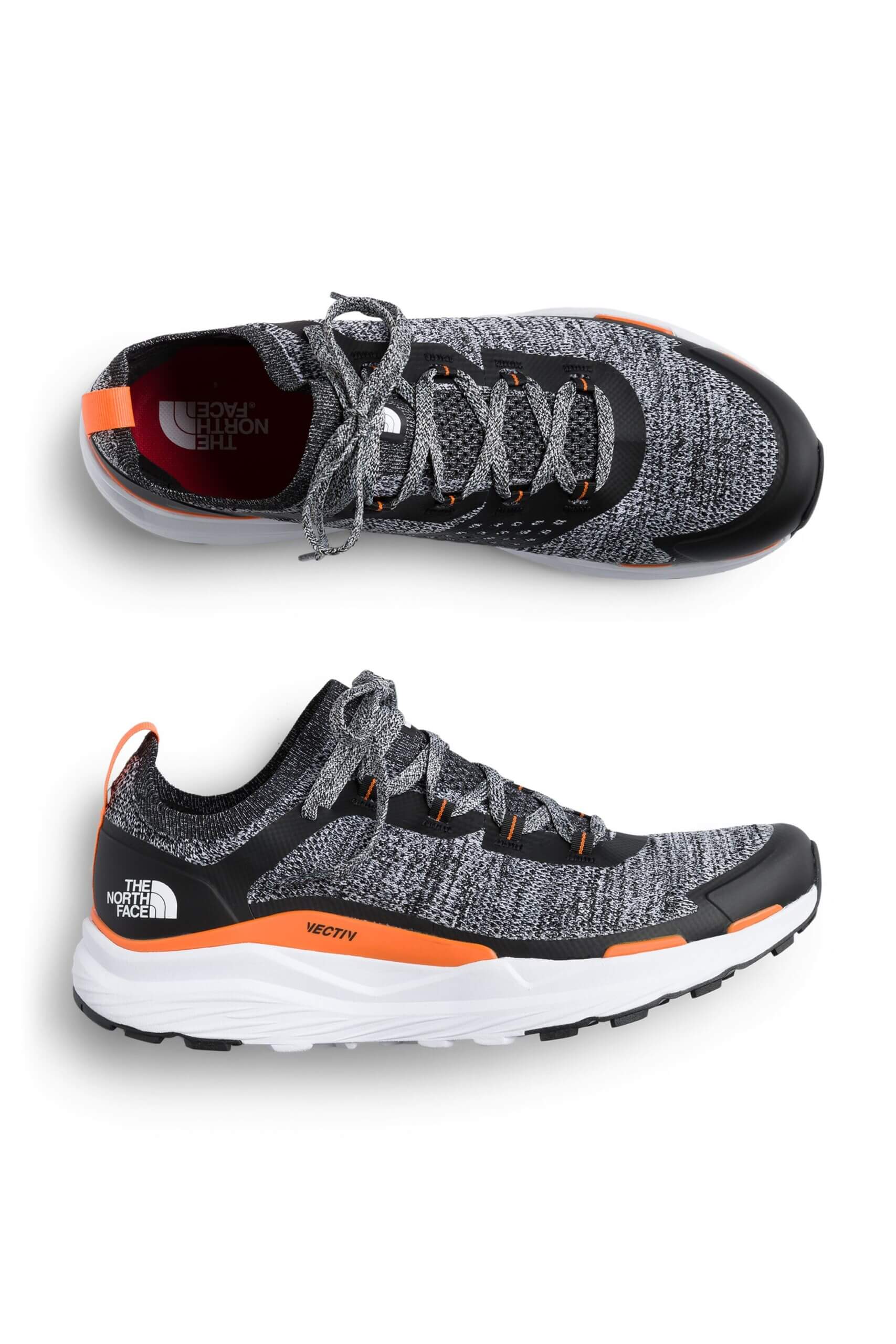 Stitch Fix men’s black and grey knit gorpcore sneakers with white, black and safety orange soles.