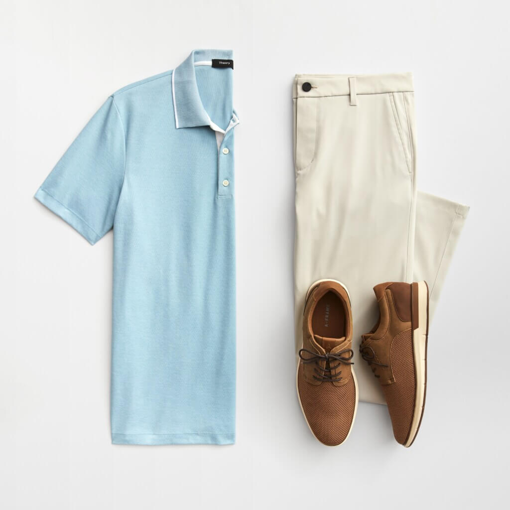 Stitch Fix men’s golf outfit featuring a light blue polo with white-tipped collar, off-white pants and brown lace-up shoes.