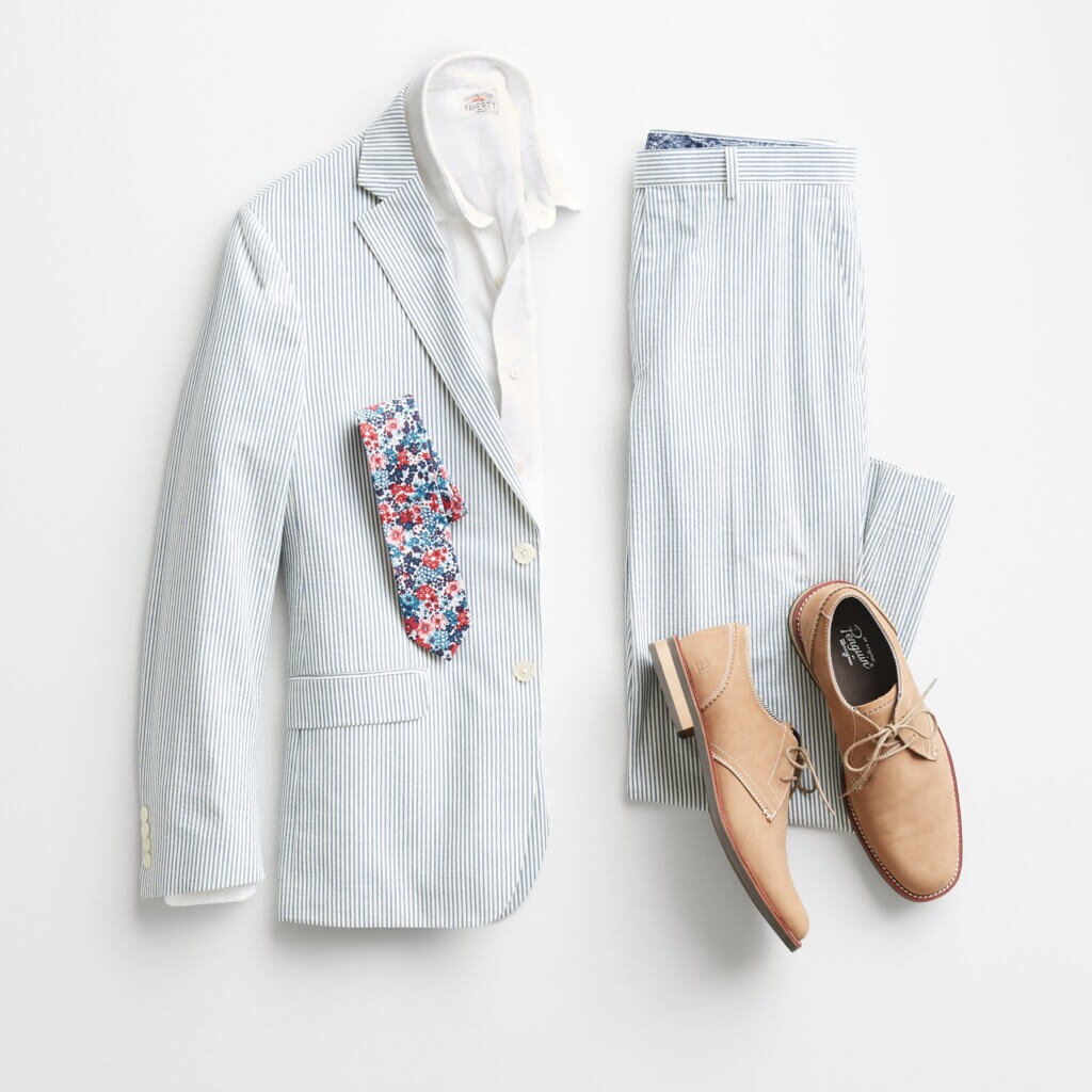 Stitch Fix men’s beach wear wedding attire outfit featuring light blue seersucker suit, white button-down shirt, floral print tie and light brown dress shoes.