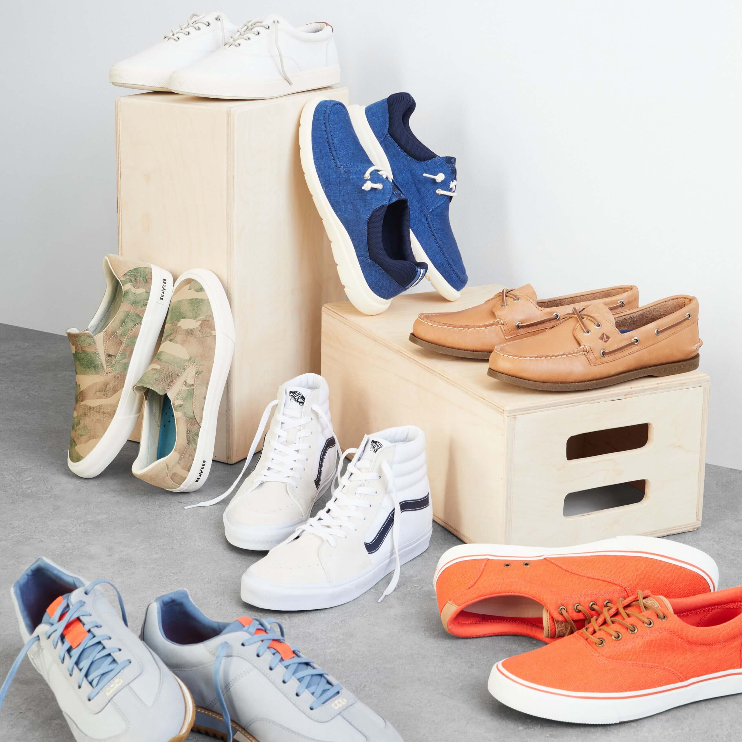Stitch Fix men’s array of sneakers in shades of, white, blue, orange, brown and green.