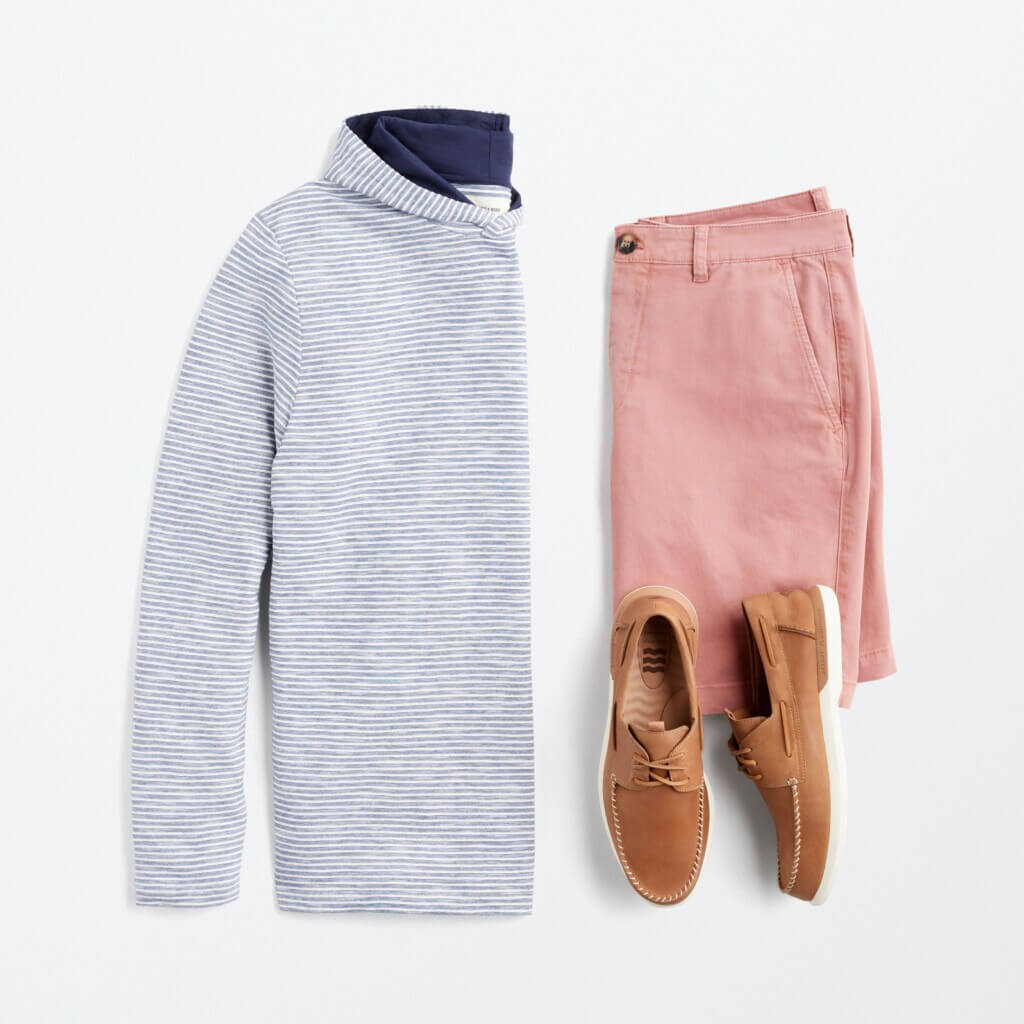 Stitch Fix men’s 4th of July outfit with light blue hoodie, red chino shorts and brown leather boat shoes.