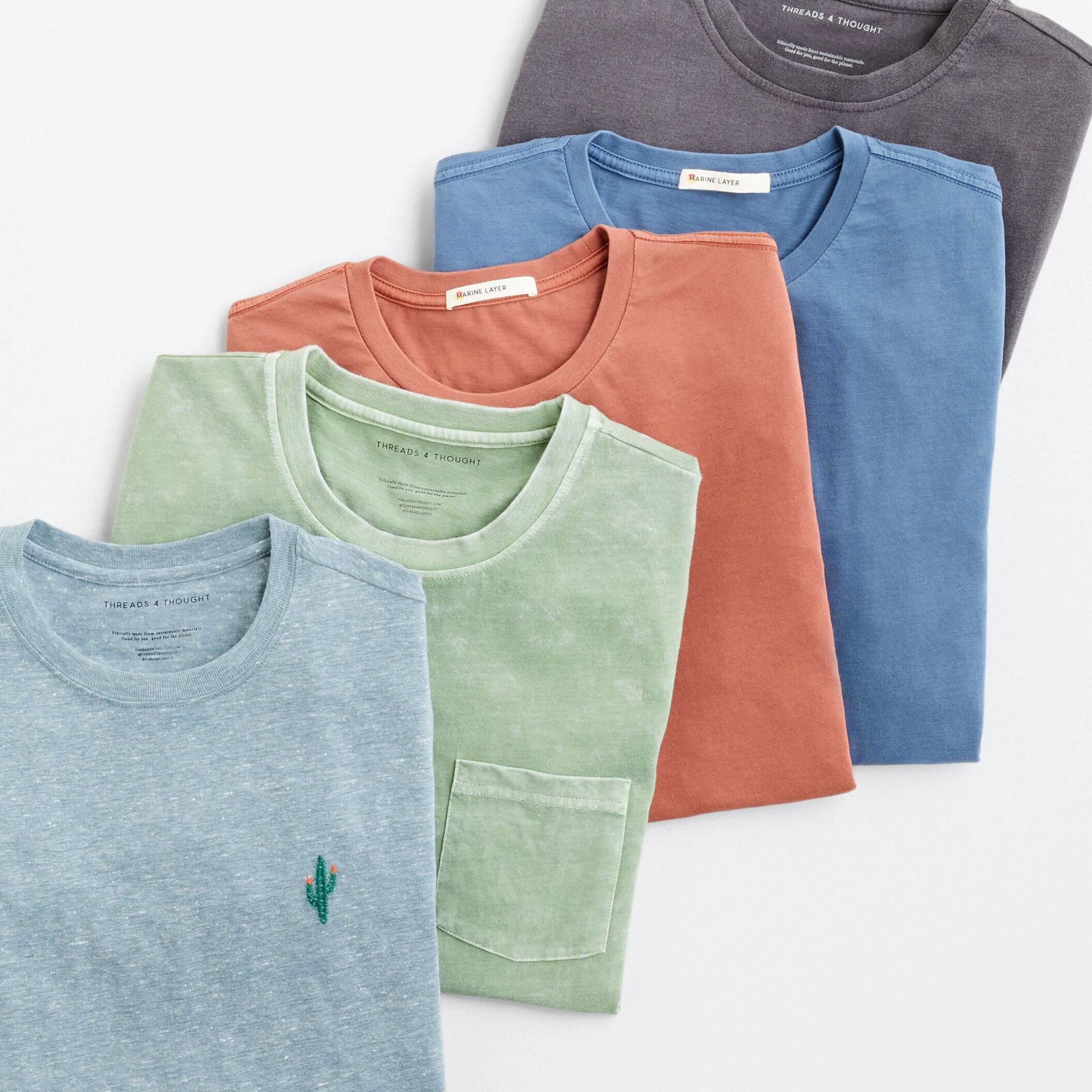 Stitch Fix men’s T-shirts in blue, green, orange and grey.