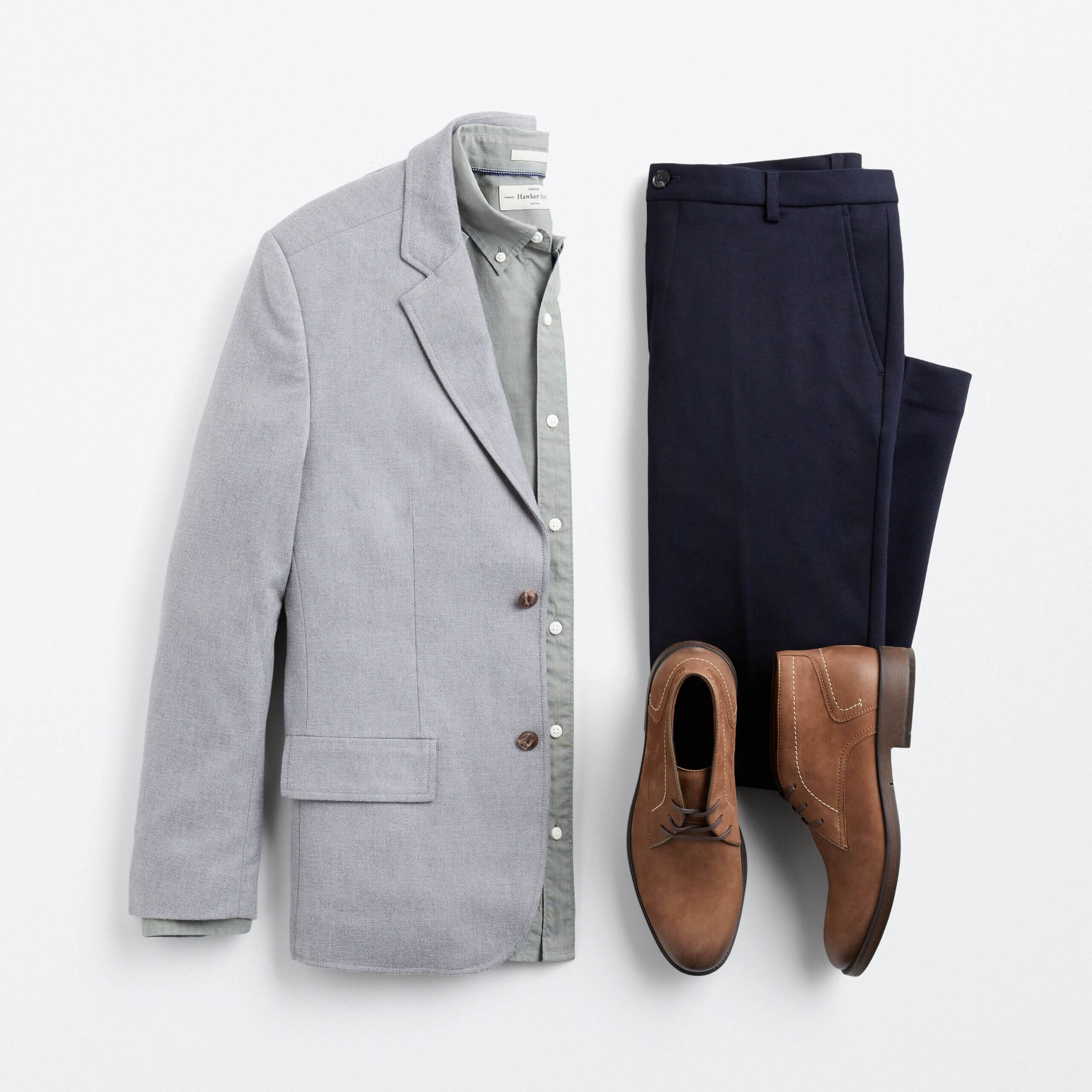 Stitch Fix men’s semi-formal wedding attire outfit with navy trousers, grey blazer, green shirt and brown chukkas.