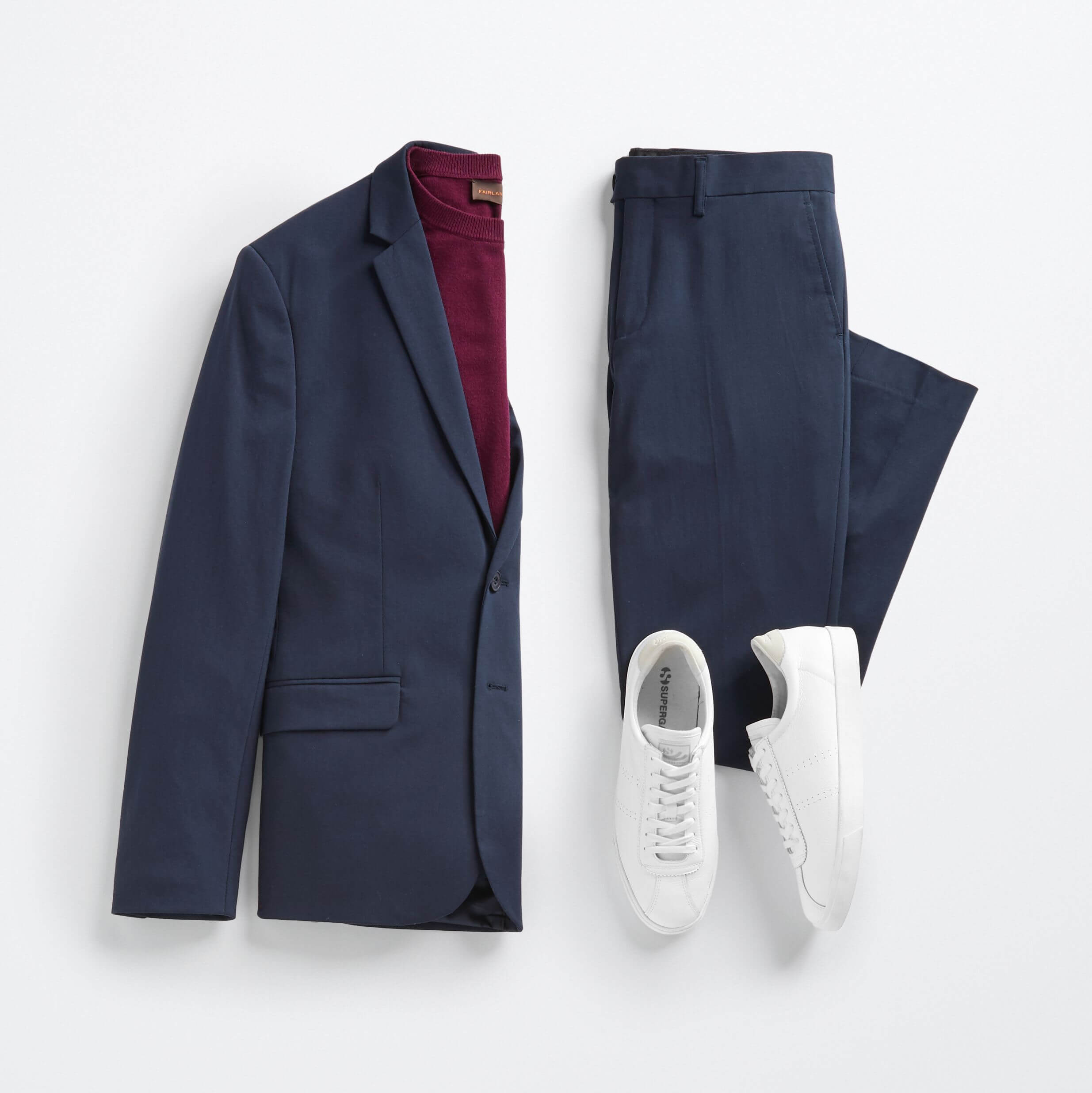 Stitch Fix men’s fall wedding attire outfit with navy blue blazer, matching pants, burgundy shirt and white sneakers.