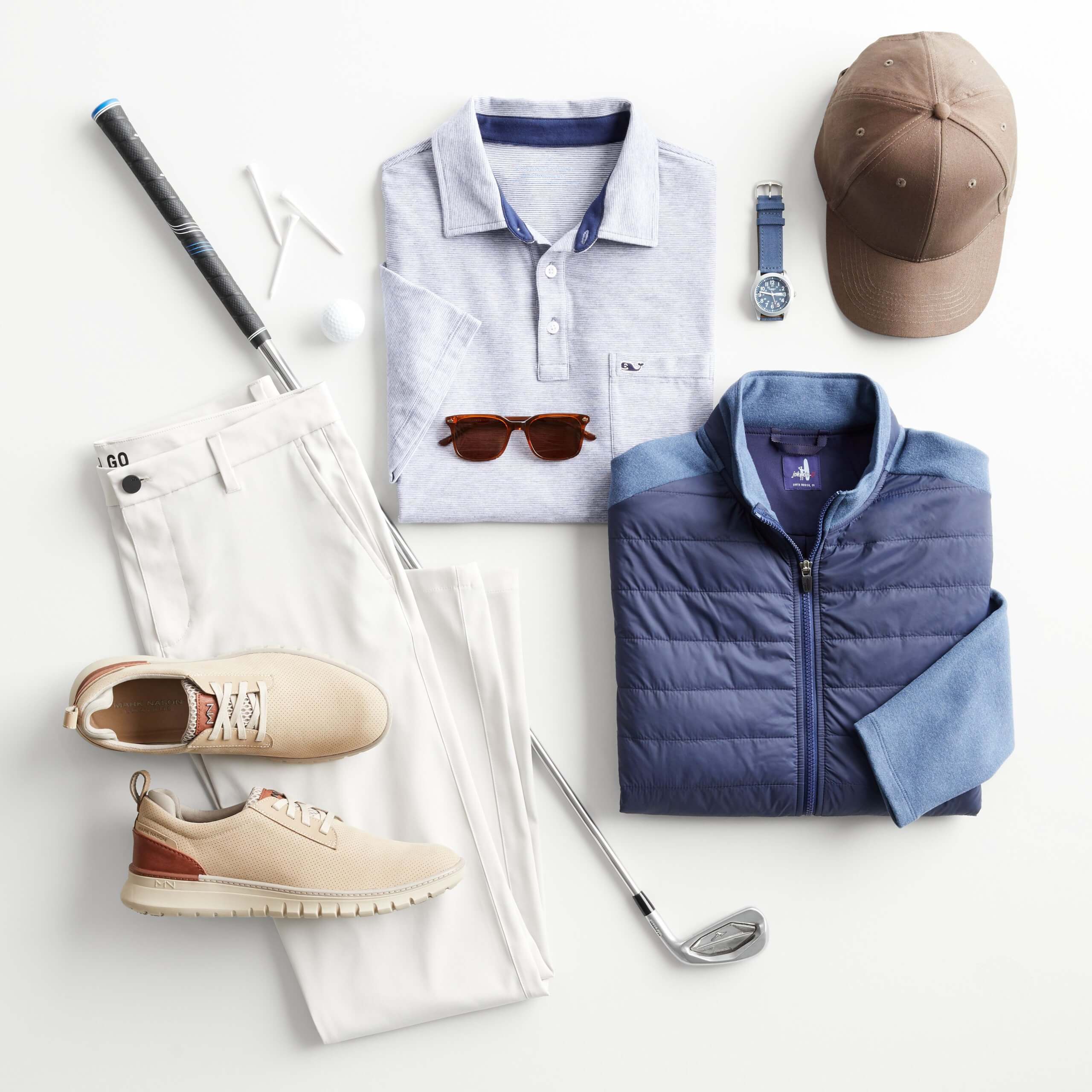 Stitch Fix Men’s outfit laydown featuring a blue polo, white pants and navy puffer jacket with a hat, sneakers, watch and golf equipment.