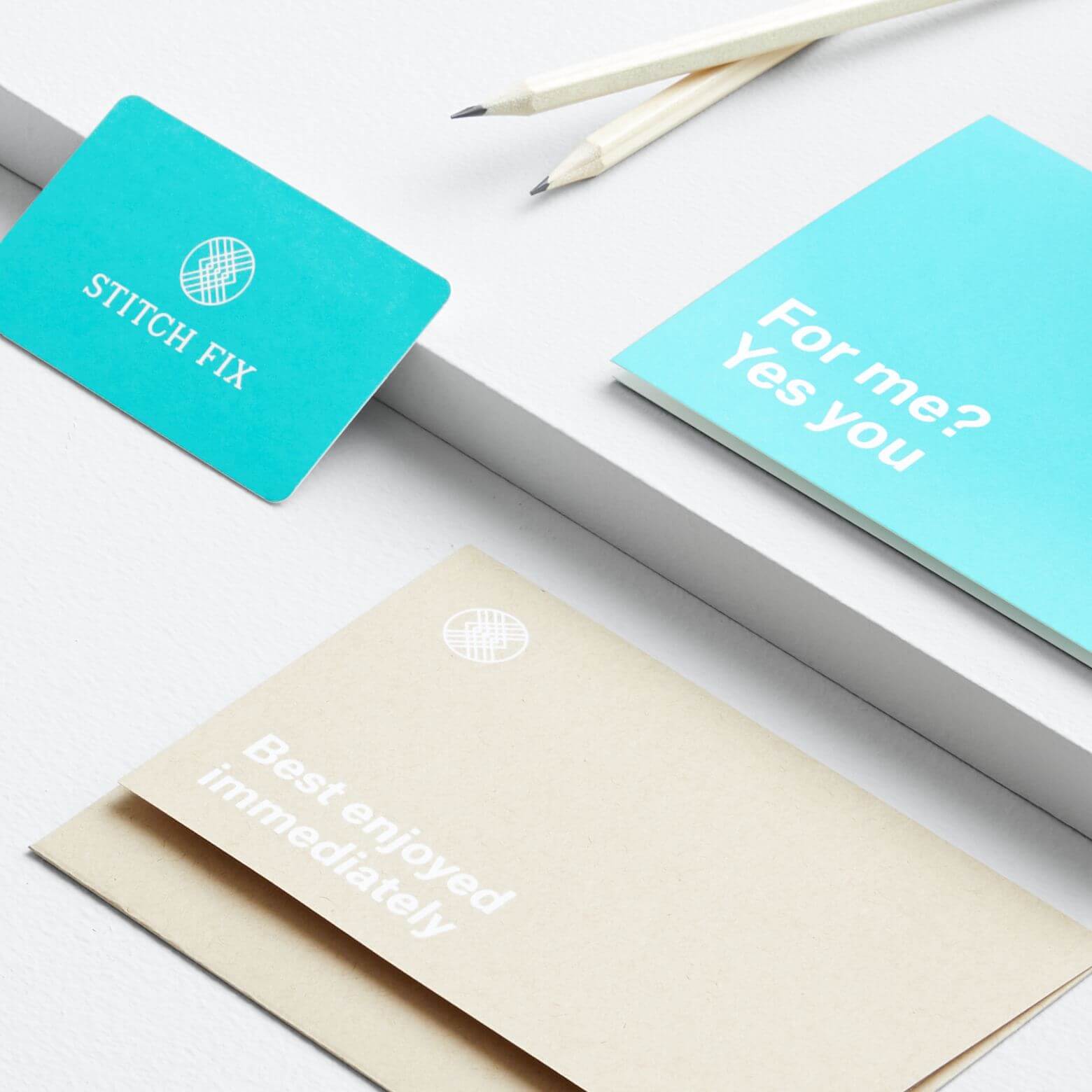 Stitch Fix gift card on a desk with two white pencils, a card reading “For me? Yes you” and a card reading “Best enjoyed immediately.”