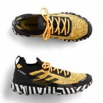 Stitch Fix men’s yellow, black and white athletic sneakers.