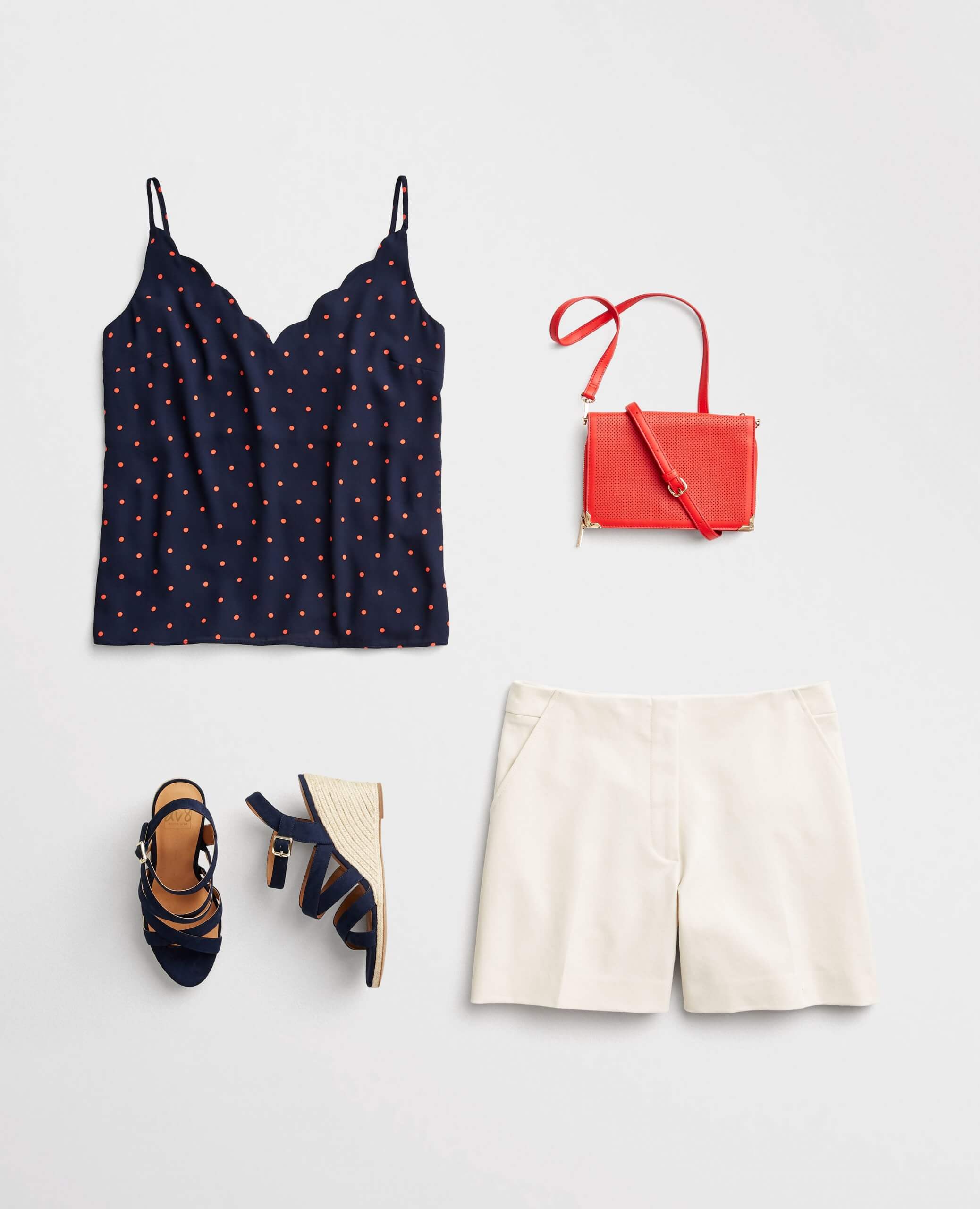 Stitch Fix women's 4th of July outfit laydown featuring a blue and red polka dot tank, white shorts, red purse and navy blue wedges.