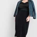 Stitch Fix women’s model wearing black lace bodysuit outfit with black ribbed midi skirt, teal green moto jacket and black booties.