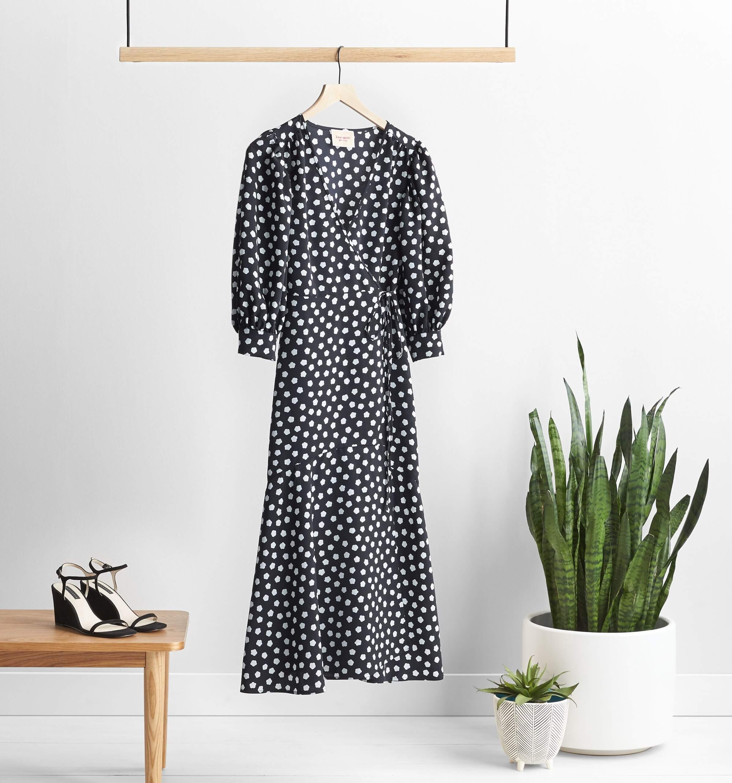 Stitch Fix maxi dress in black with white abstract floral print and balloon-sleeves next to black heels and potted plants.