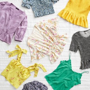 Stitch Fix women’s styles in an array of purple, yellow, green, white and floral printed blouses.